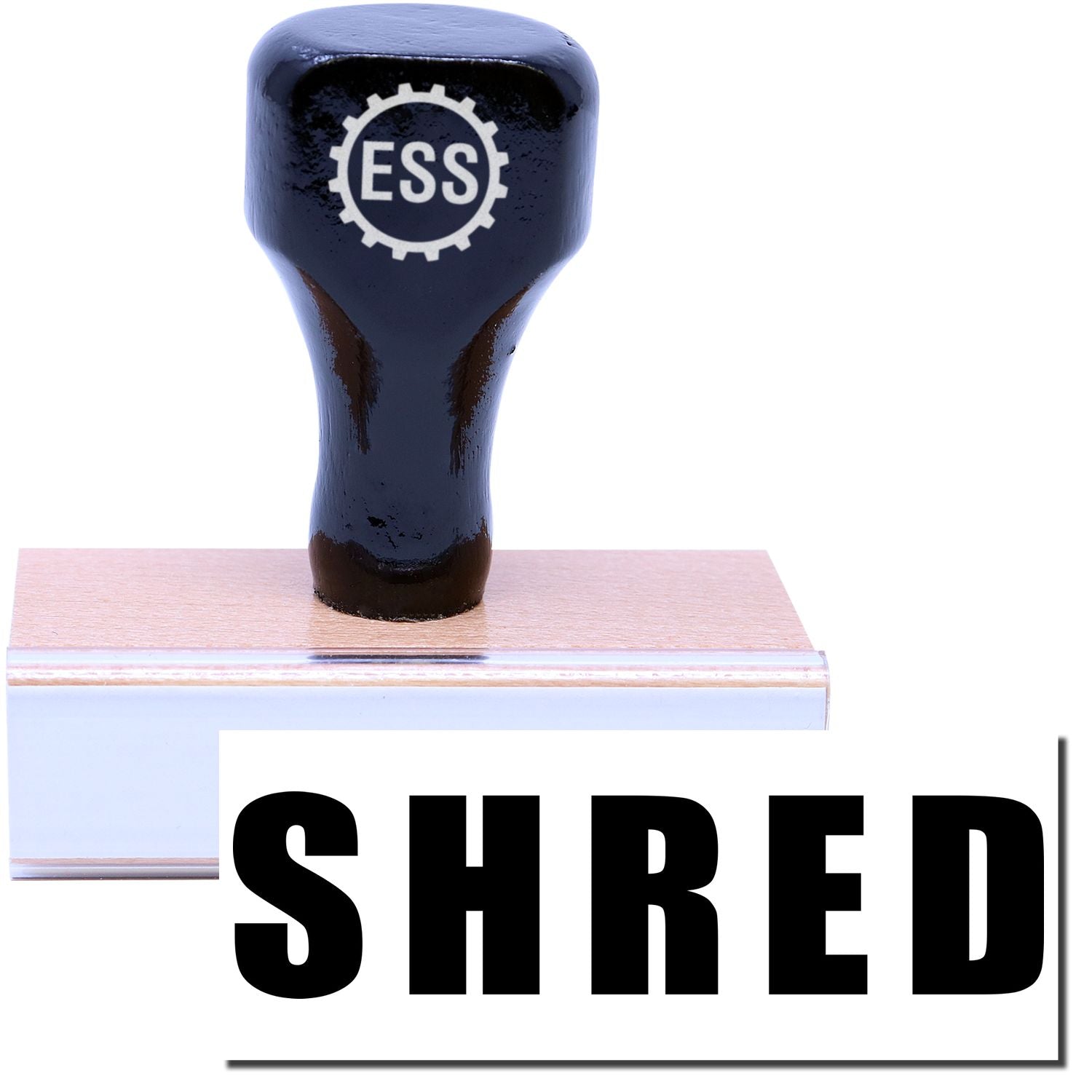 A stock office rubber stamp with a stamped image showing how the text "SHRED" in bold font is displayed after stamping.