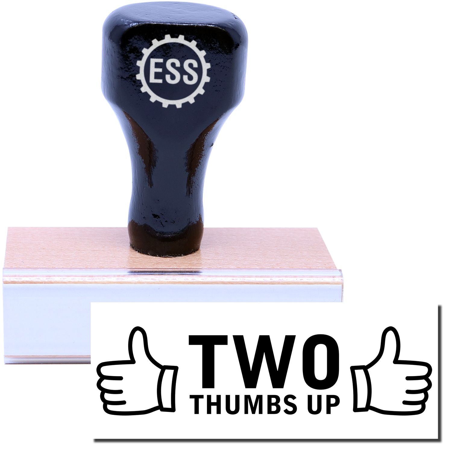 A stock office rubber stamp with a stamped image showing how the text TWO THUMBS UP in large font with two thumbs pointing up on each side of the text is displayed after stamping.