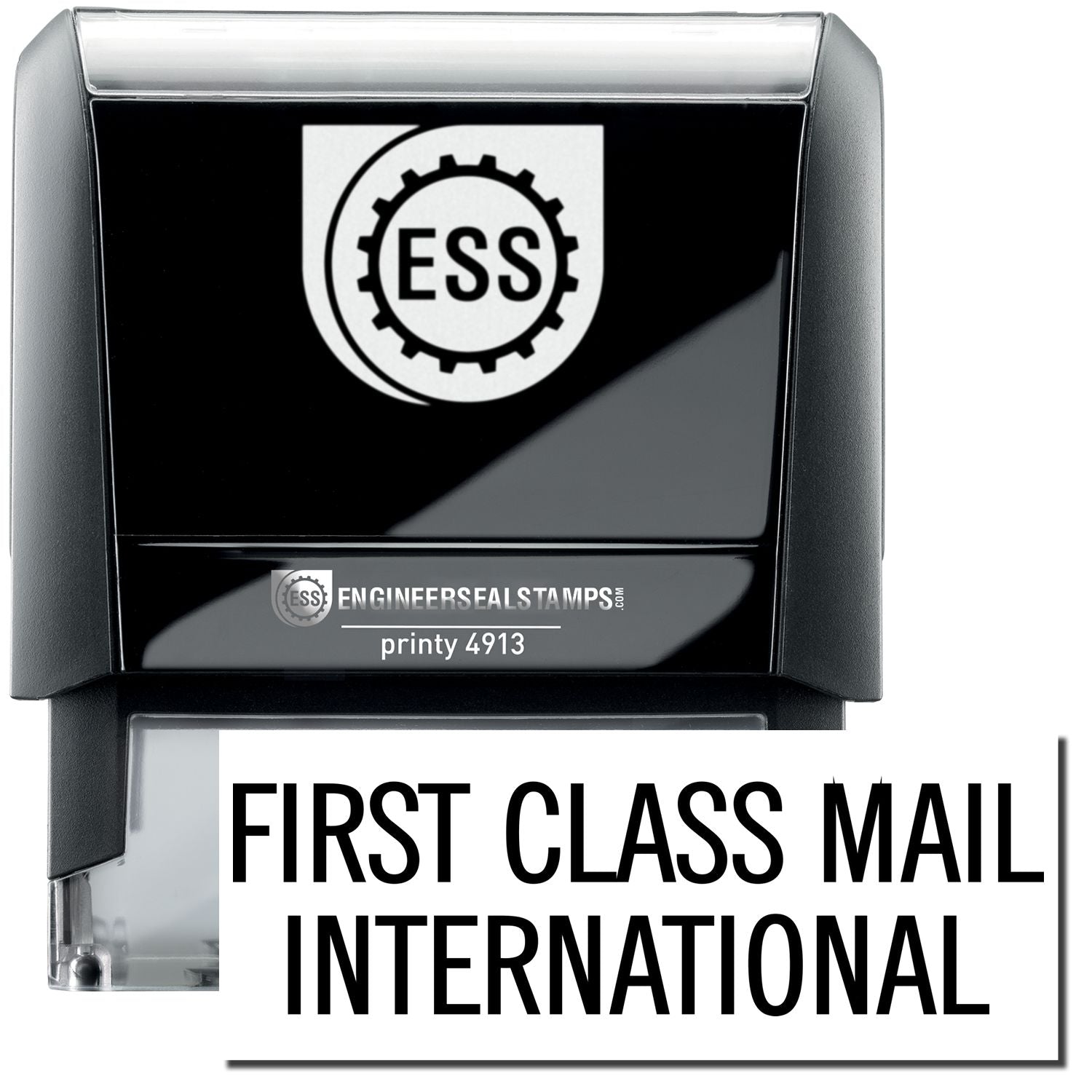 A self-inking stamp with a stamped image showing how the text FIRST CLASS MAIL INTERNATIONAL in a large font is displayed by it after stamping.