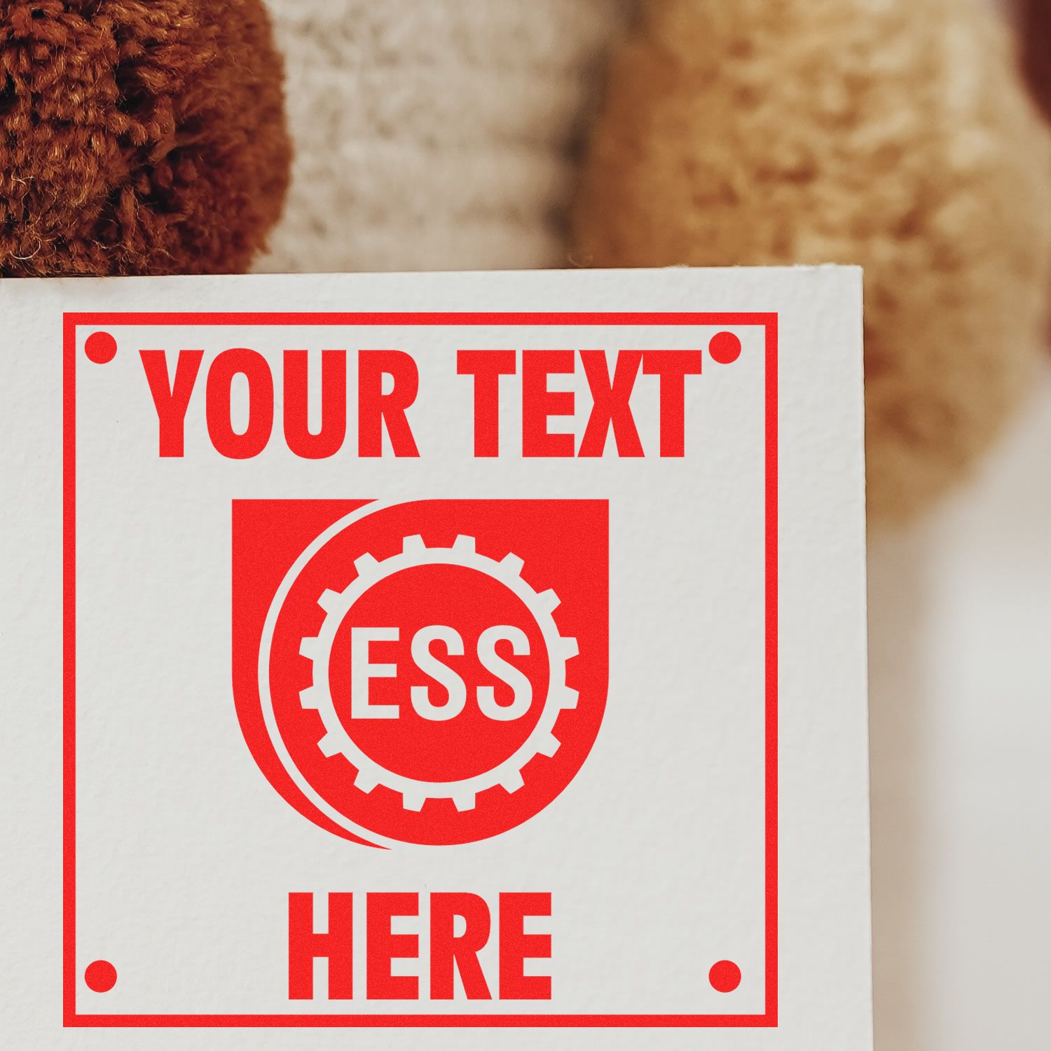 Custom Rubber Stamp Size 3 x 3 with red YOUR TEXT HERE imprint on white paper, featuring the ESS logo in the center.