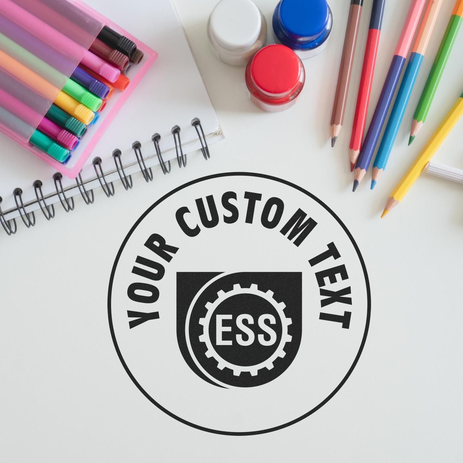 Custom Rubber Stamp Size 3 Inch Diameter with Your Custom Text imprint on paper, surrounded by colorful pens, markers, and a notebook.