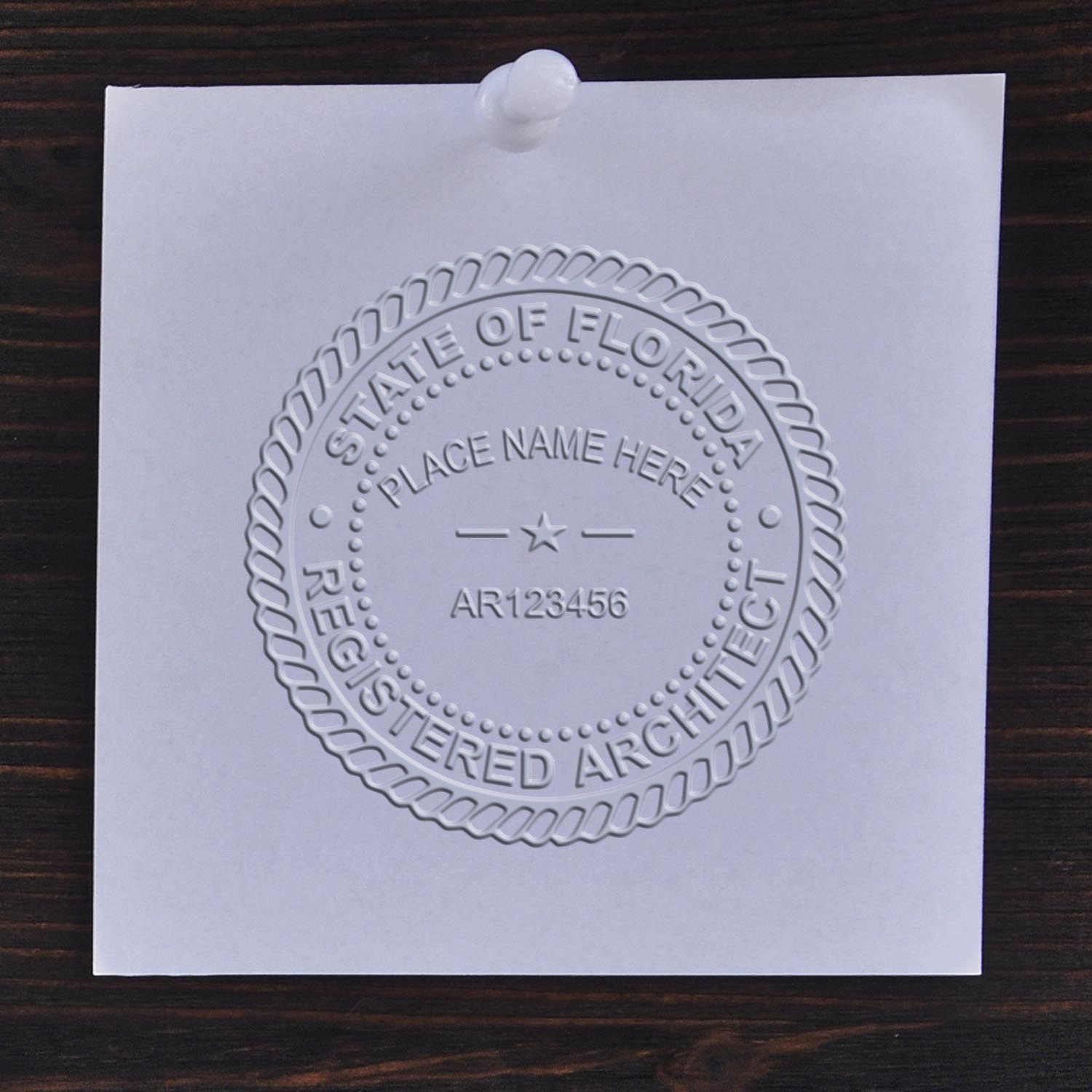 A stamped impression of the Florida Desk Architect Embossing Seal in this stylish lifestyle photo, setting the tone for a unique and personalized product.