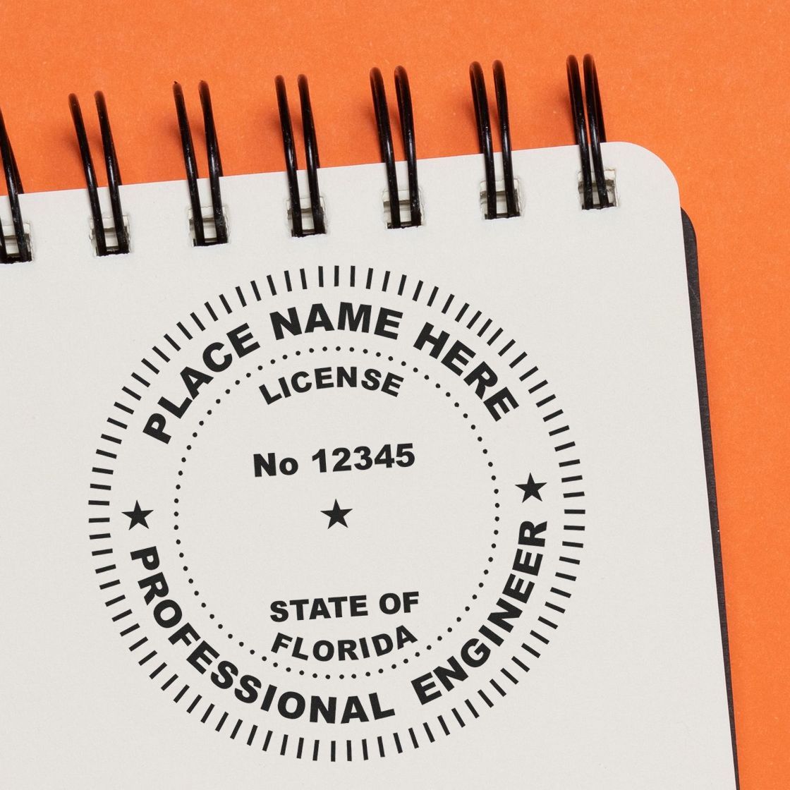 A lifestyle photo showing a stamped image of the Slim Pre-Inked Florida Professional Engineer Seal Stamp on a piece of paper