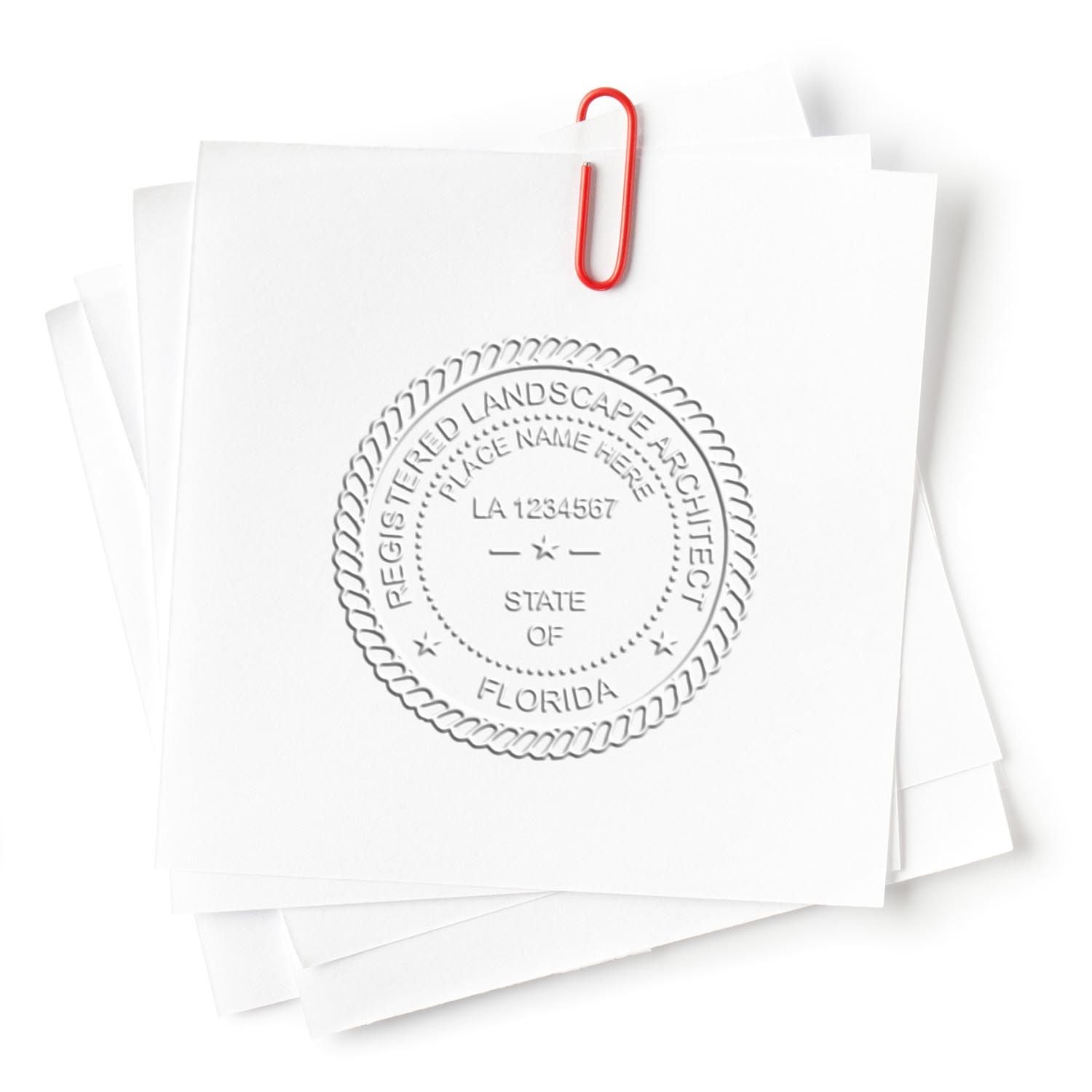 A lifestyle photo showing a stamped image of the State of Florida Extended Long Reach Landscape Architect Seal Embosser on a piece of paper