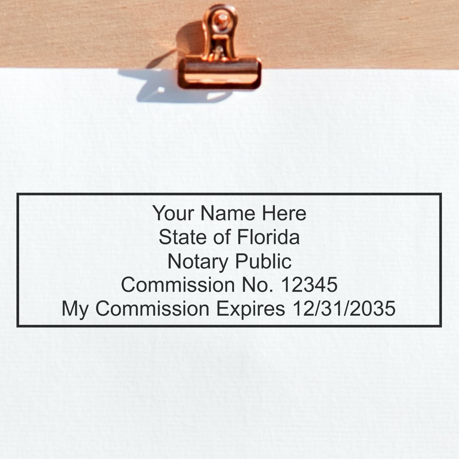 This paper is stamped with a sample imprint of the Slim Pre-Inked Rectangular Notary Stamp for Florida, signifying its quality and reliability.