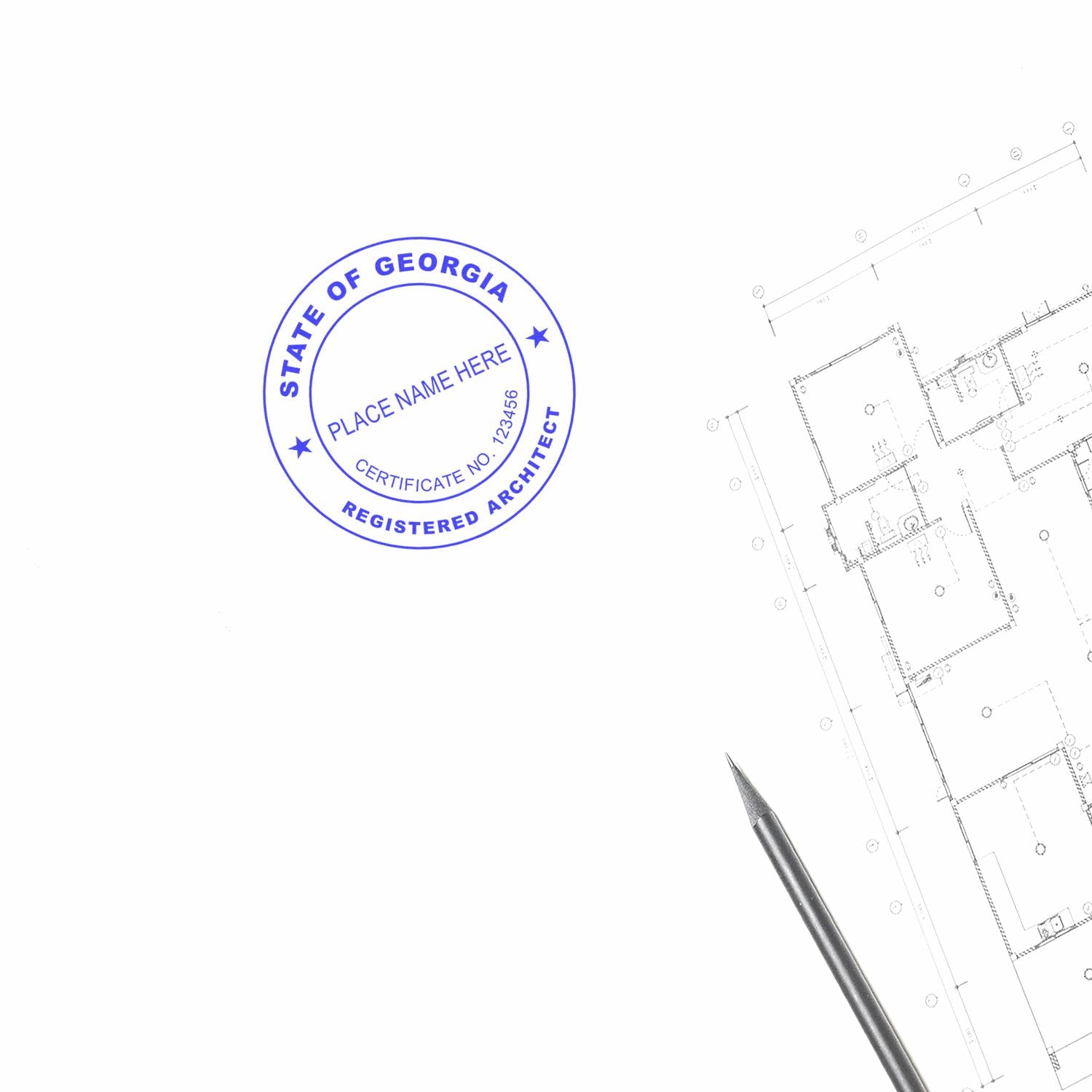 Premium MaxLight Pre-Inked Georgia Architectural Stamp used on a blueprint next to a pen."