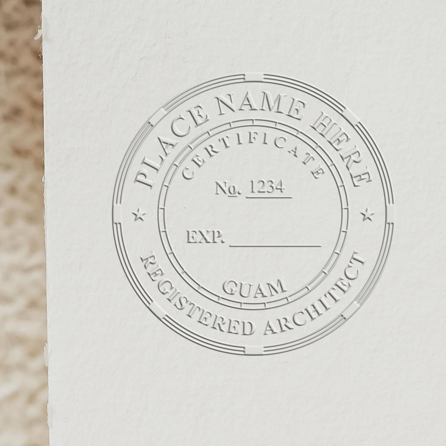 A lifestyle photo showing a stamped image of the Guam Desk Architect Embossing Seal on a piece of paper