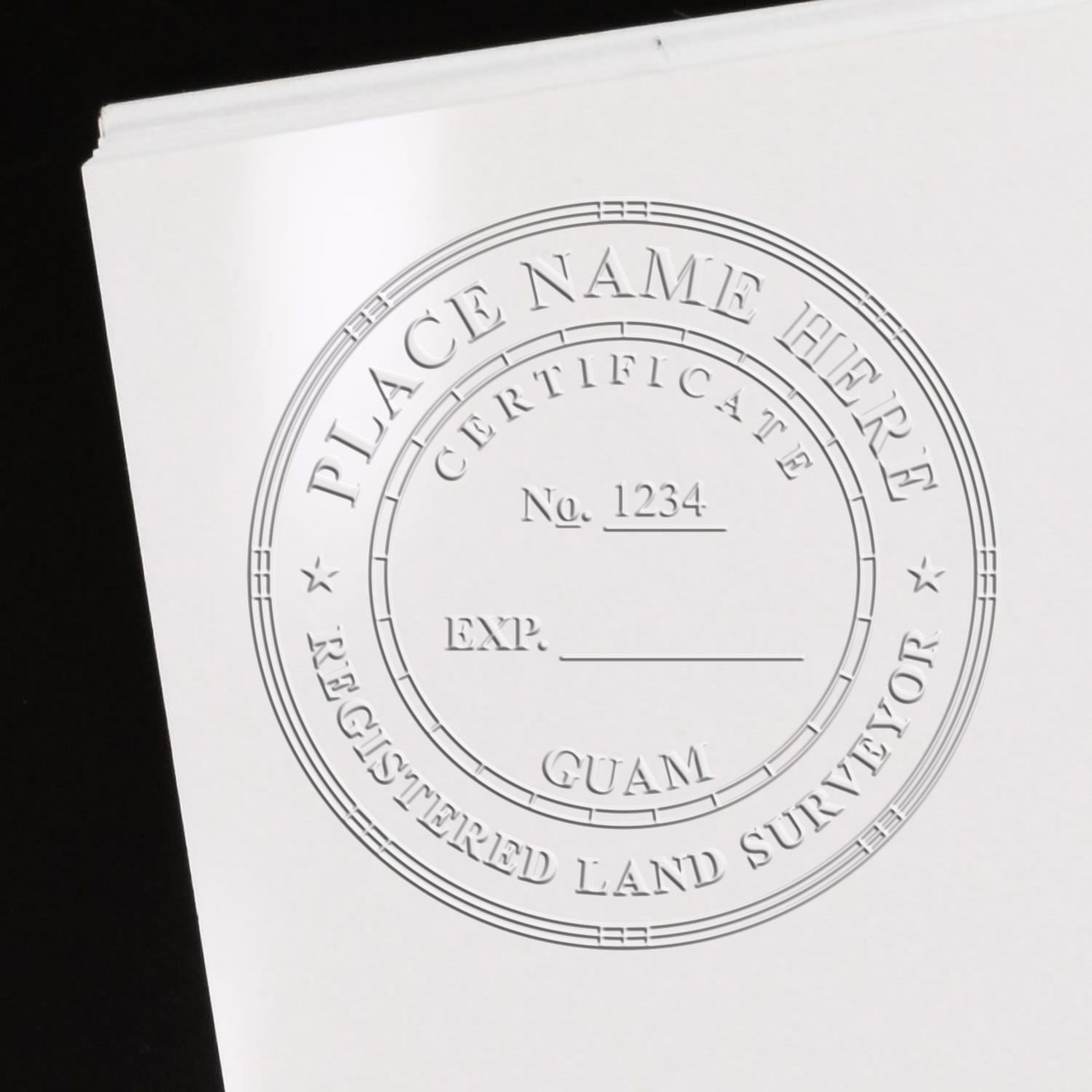 Another Example of a stamped impression of the Heavy Duty Cast Iron Guam Land Surveyor Seal Embosser on a piece of office paper.