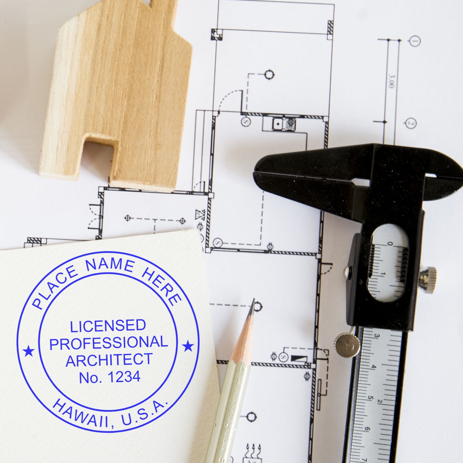 Hawaii Architect Seal Stamp on architectural plans with a pencil, caliper, and wooden house model.