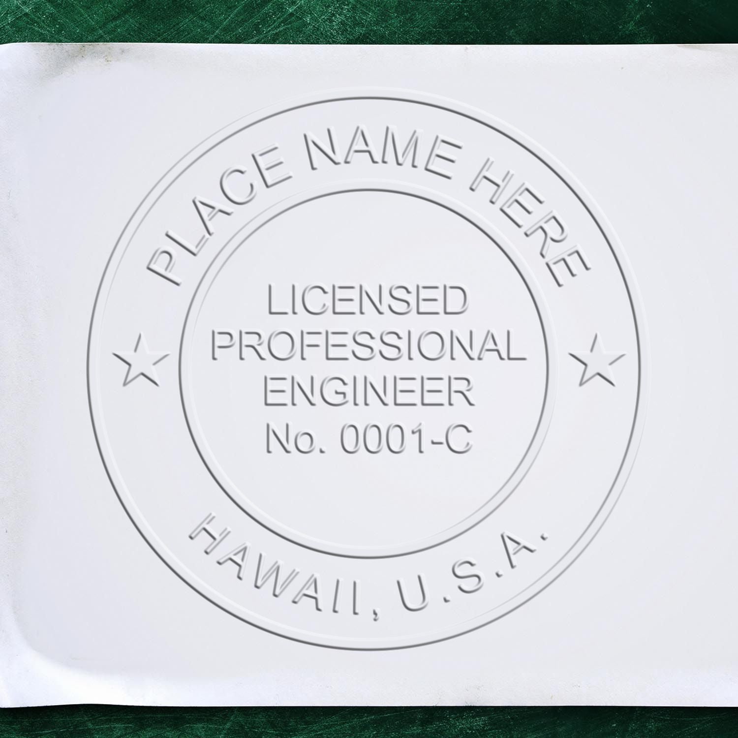 An alternative view of the Heavy Duty Cast Iron Hawaii Engineer Seal Embosser stamped on a sheet of paper showing the image in use