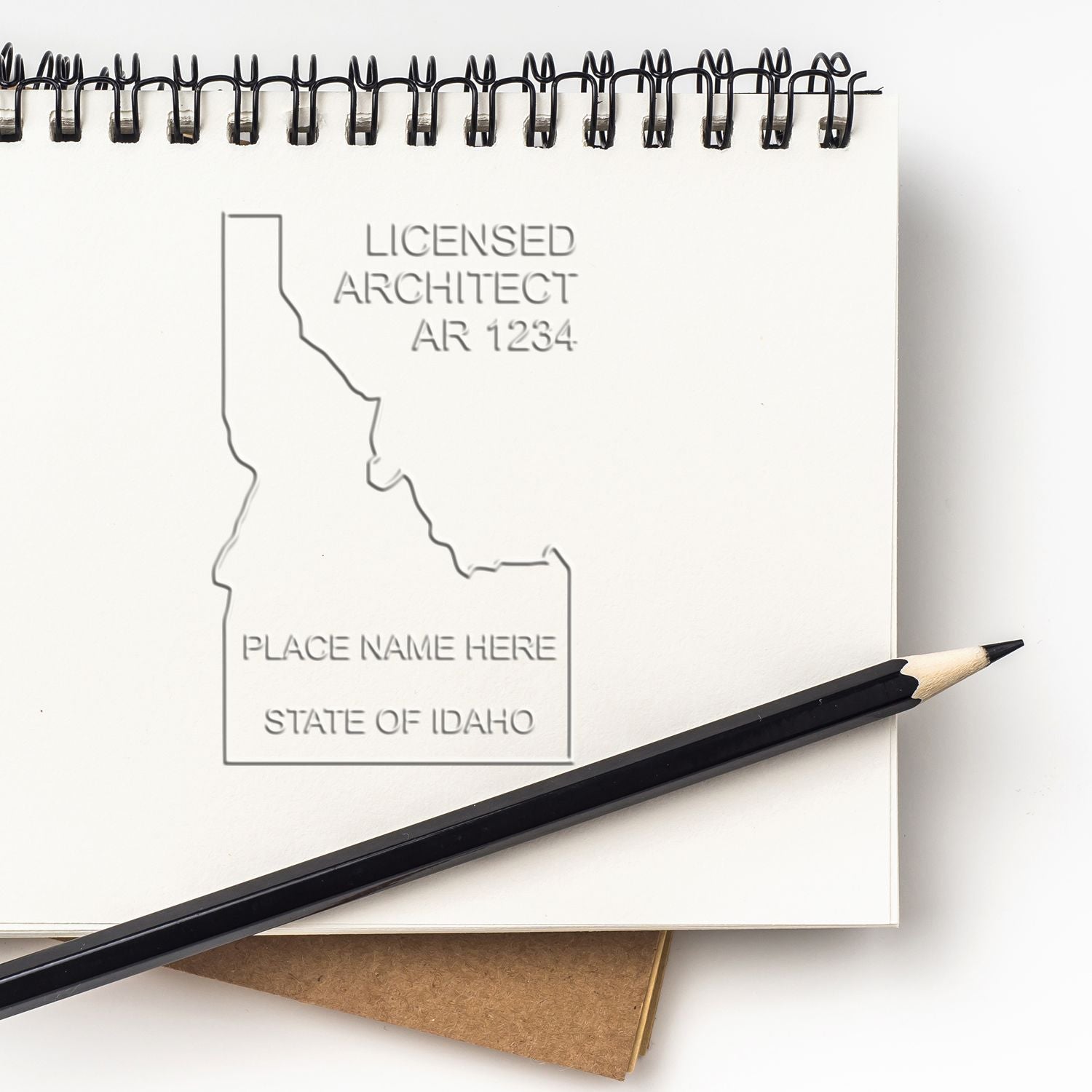 State of Idaho Long Reach Architectural Embossing Seal in use photo showing a stamped imprint of the State of Idaho Long Reach Architectural Embossing Seal