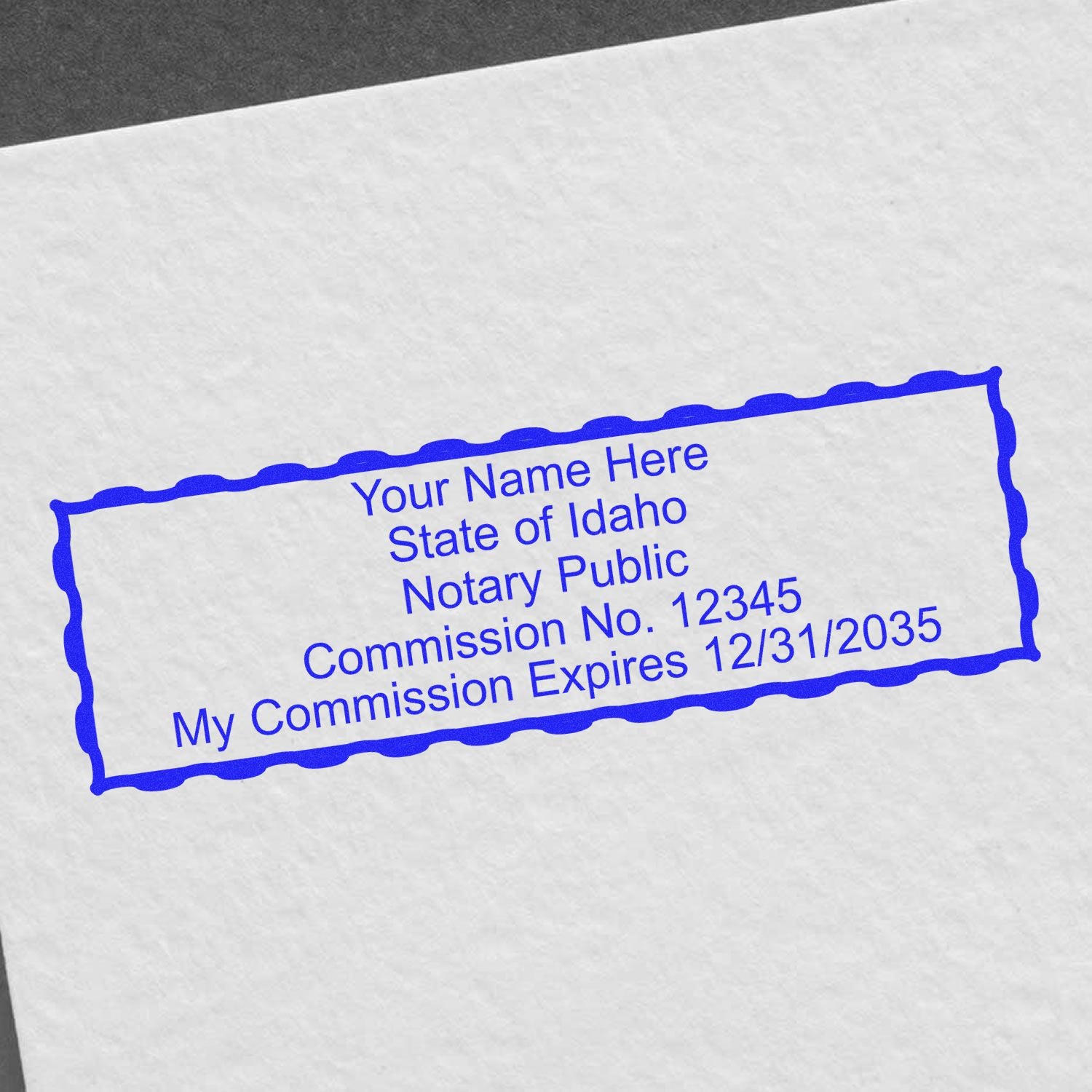 This paper is stamped with a sample imprint of the Slim Pre-Inked Rectangular Notary Stamp for Idaho, signifying its quality and reliability.