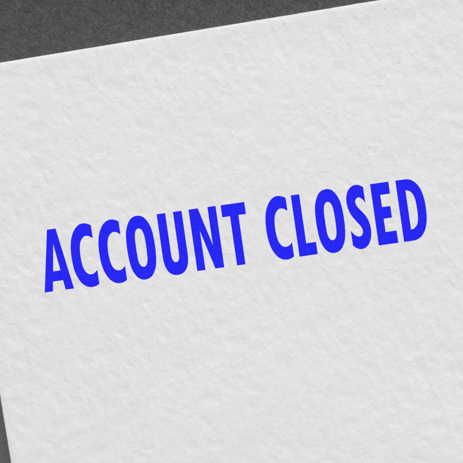 Document stamped with 'ACCOUNT CLOSED' in bold blue letters using the Self Inking Account Closed Stamp on a white paper.