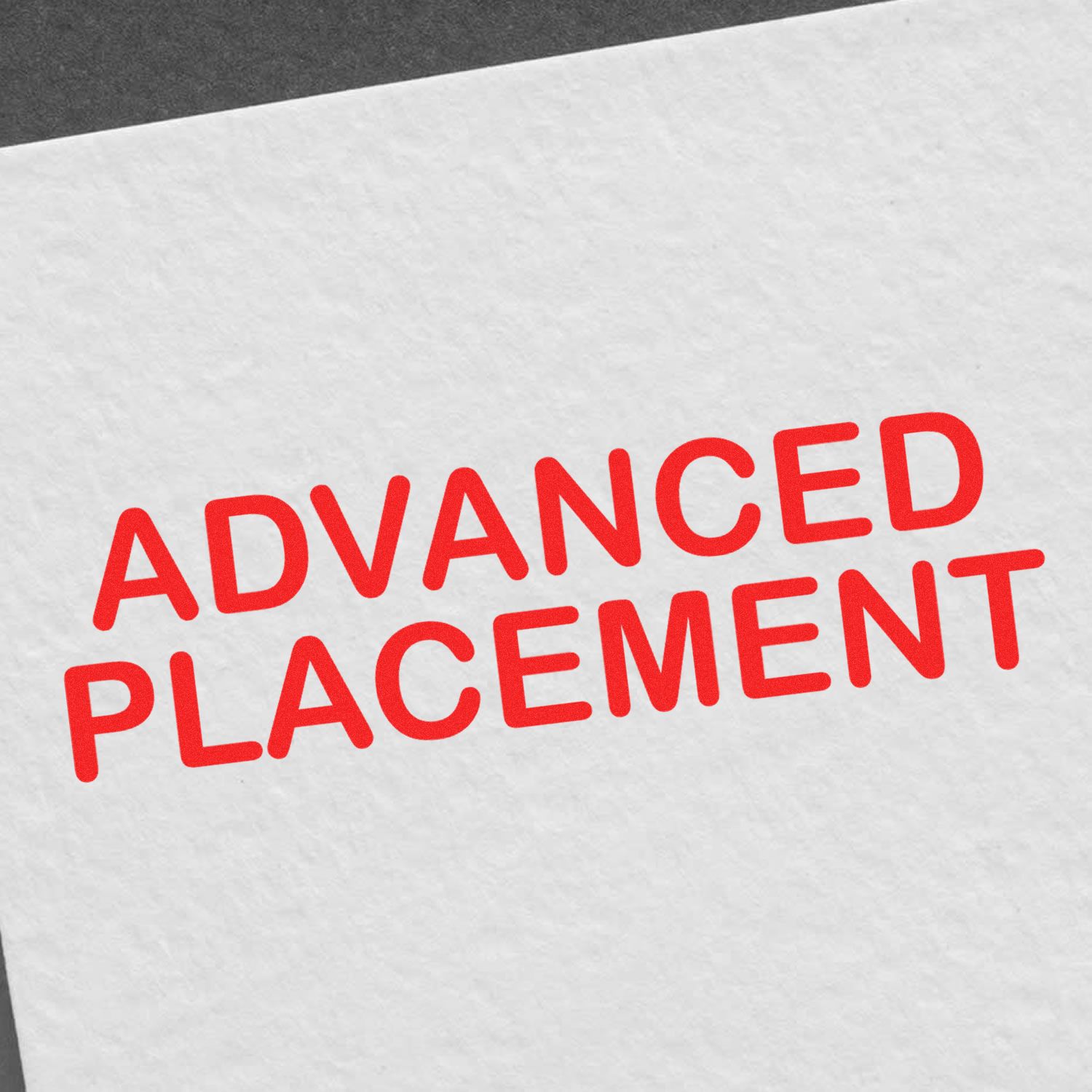 A red Advanced Placement mark on white paper, made with the Self Inking Advanced Placement Stamp.