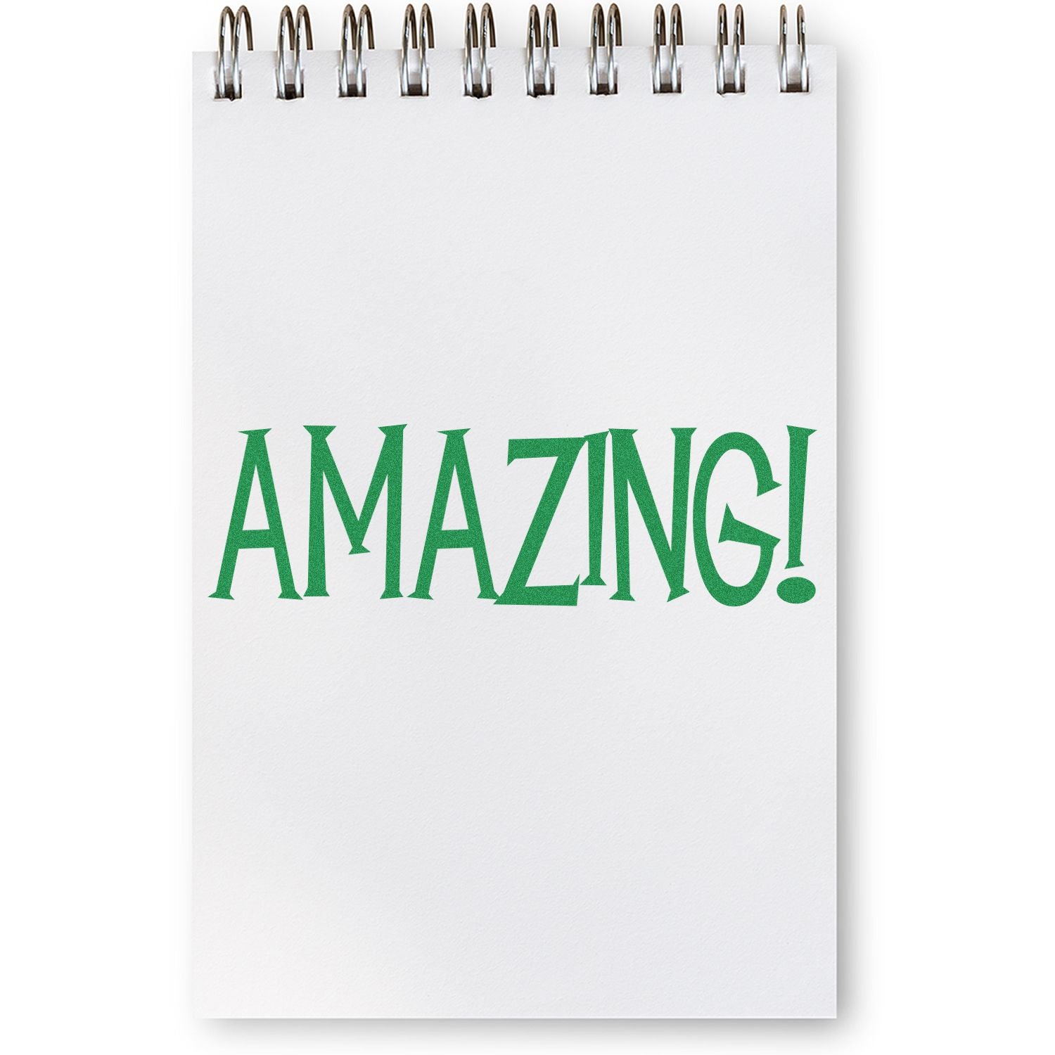 A notepad with the word AMAZING! stamped in green using the Large Self Inking Amazing Stamp.