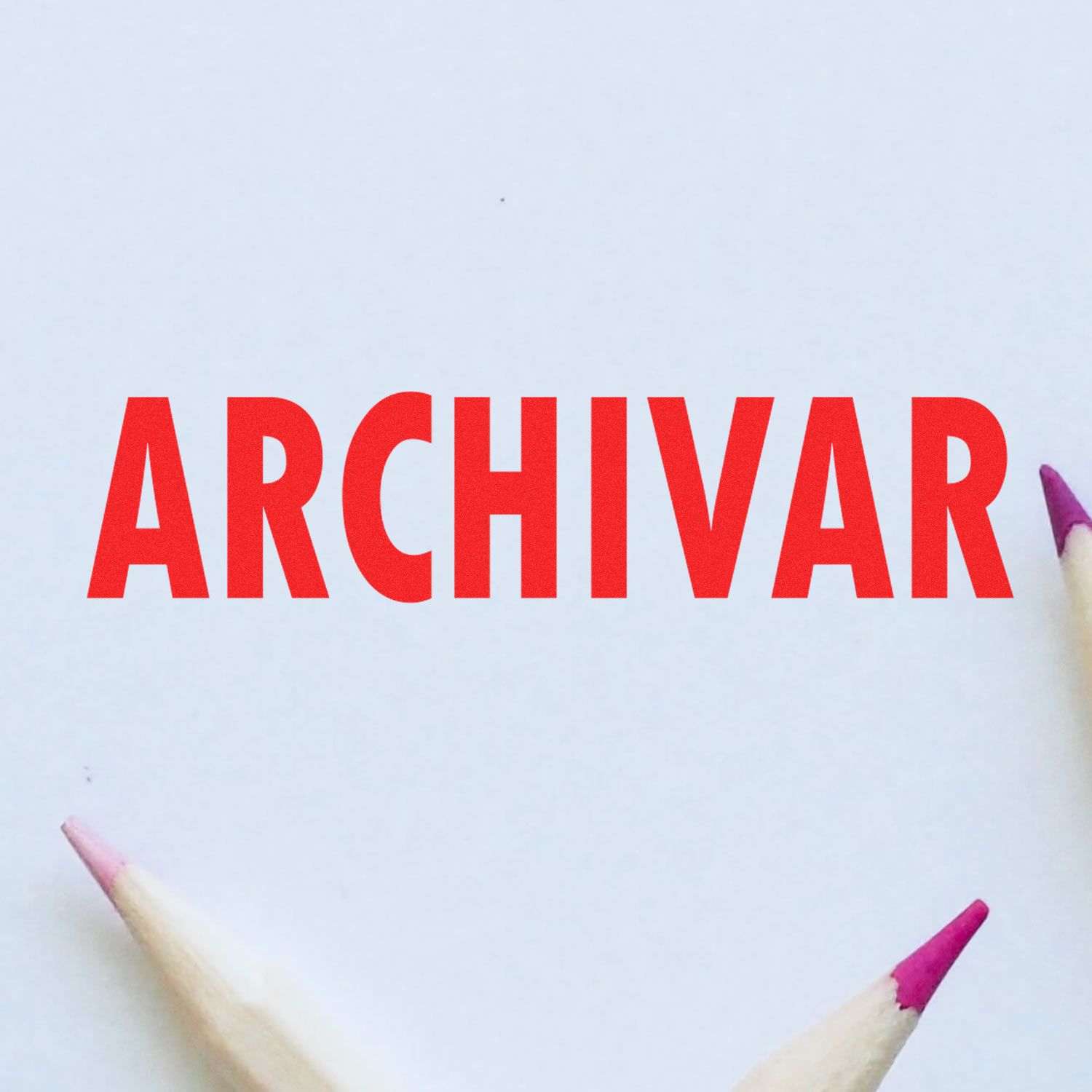 Self Inking Archivar Stamp in use, displaying the word 'ARCHIVAR' in bold red letters on white paper, surrounded by colored pencil tips.