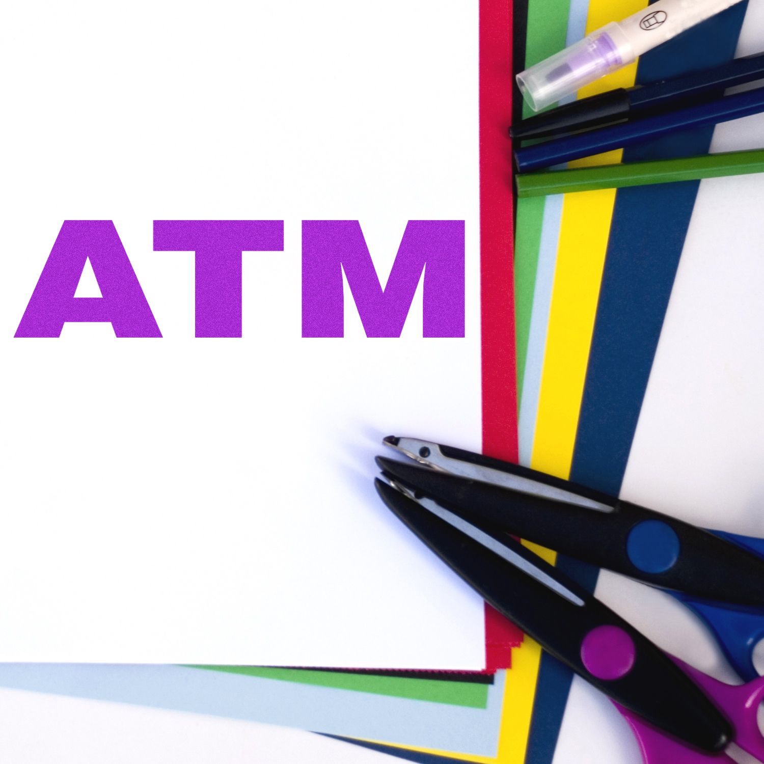 Self Inking ATM Stamp in use on paper, surrounded by colorful sheets, scissors, and pens.