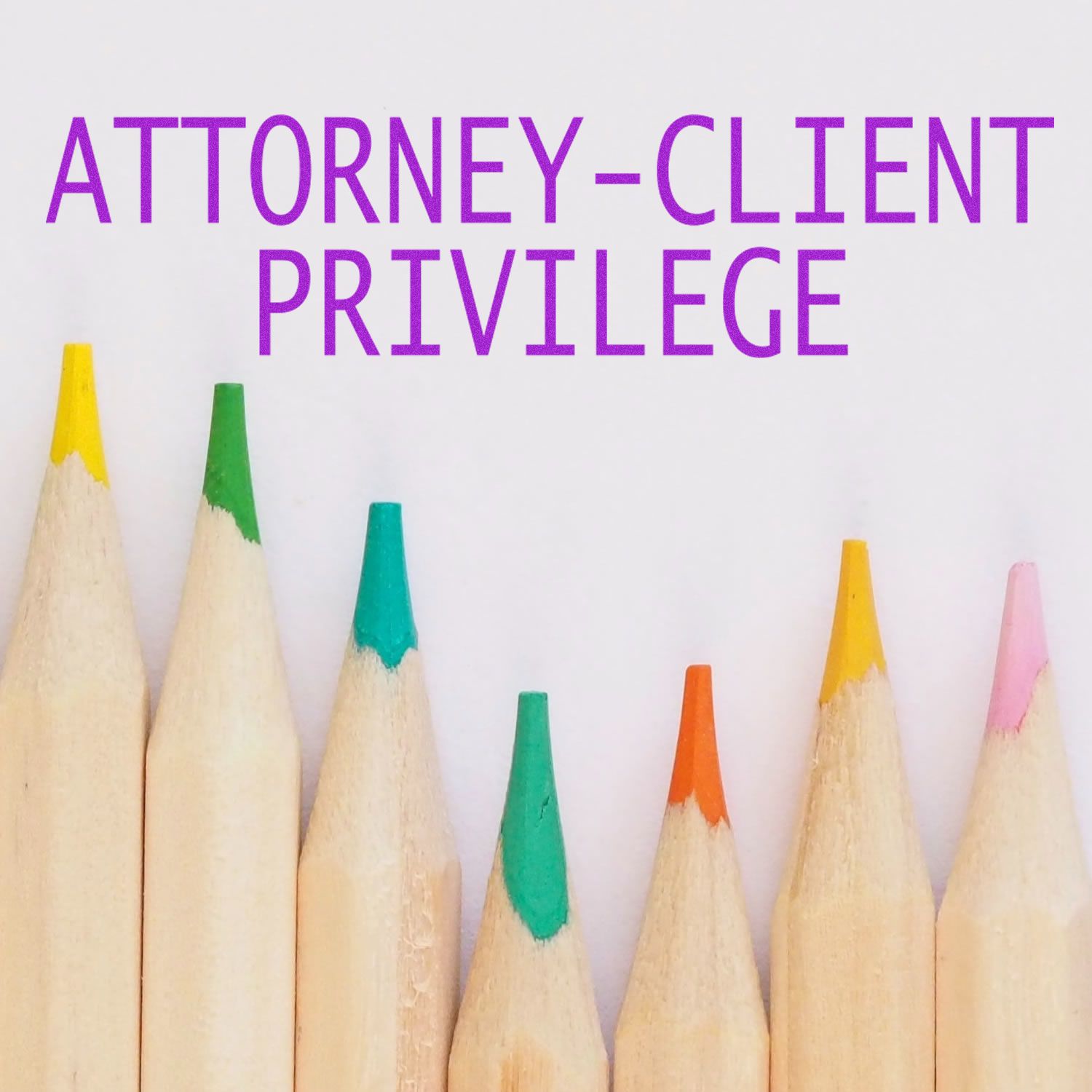 Large Self Inking Attorney Client Privilege Stamp marking ATTORNEY-CLIENT PRIVILEGE on a white surface with colored pencils below.