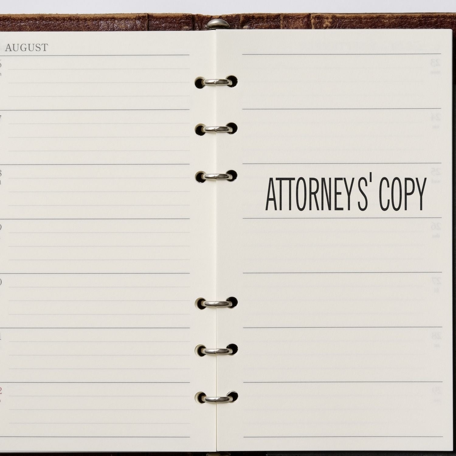 Open planner with ATTORNEYS' COPY stamped on the right page using the Large Attorneys' Copy Rubber Stamp.