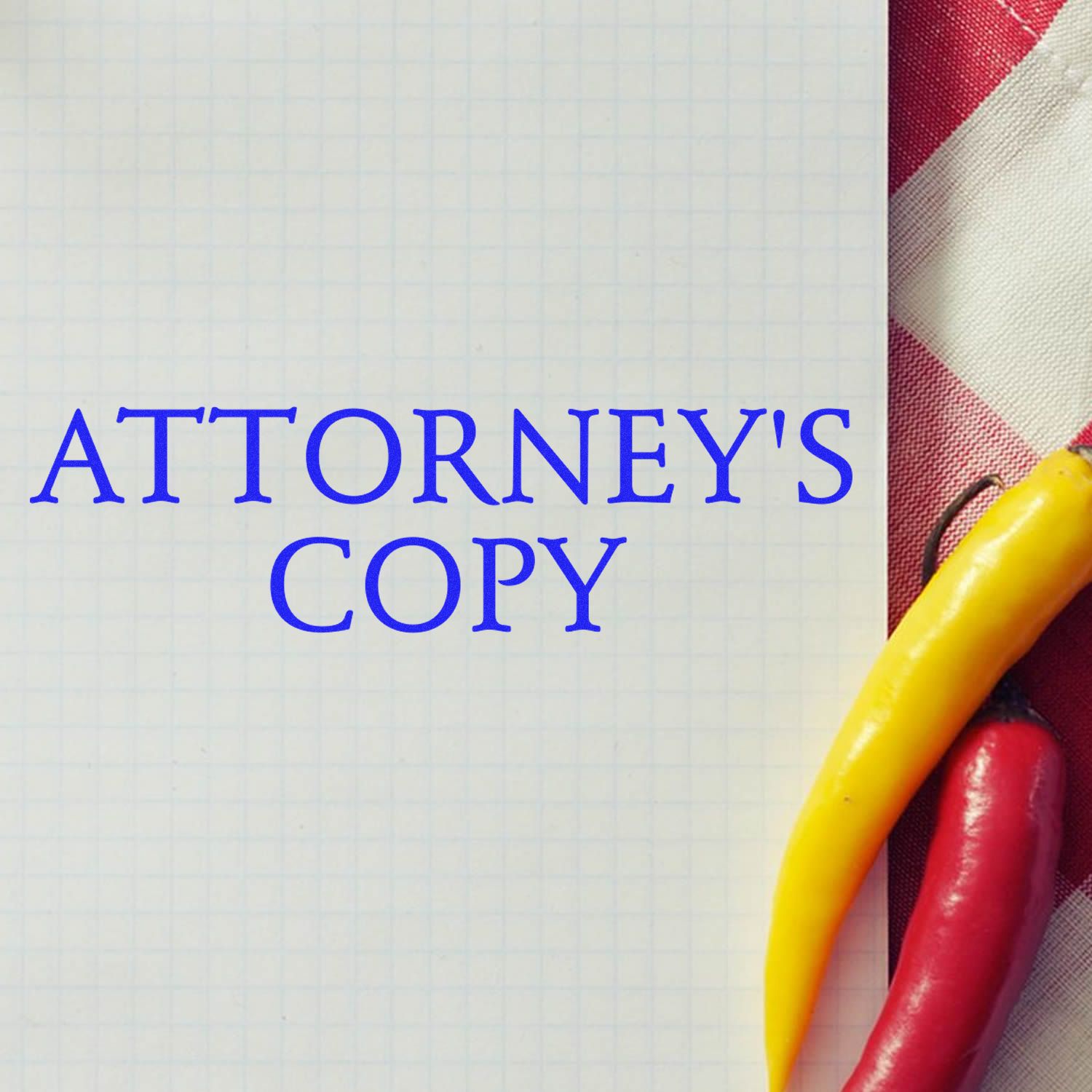 Attorneys Copy Rubber Stamp on a grid paper with yellow and red chili peppers on a red and white checkered cloth background.