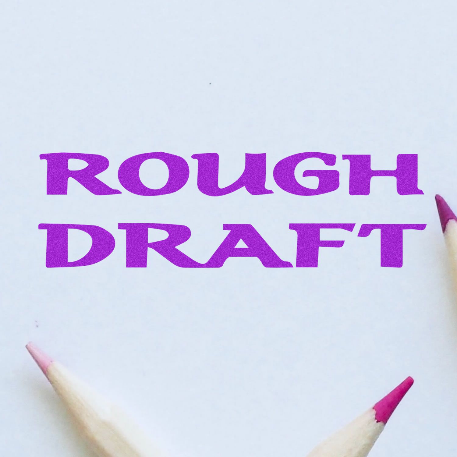 Large Self Inking Bold Rough Draft Stamp imprint in purple on white paper, with three sharpened pencils pointing towards the text.