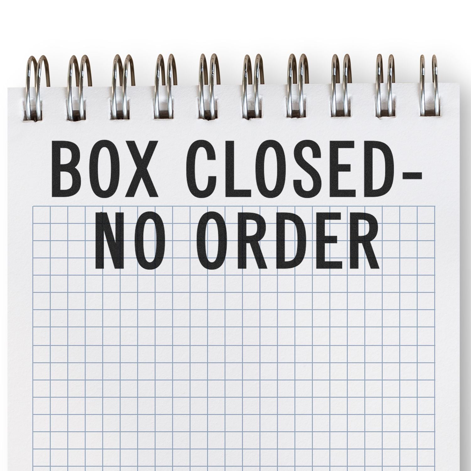 A rubber stamp imprint on a grid notebook page reads "BOX CLOSED - NO ORDER."