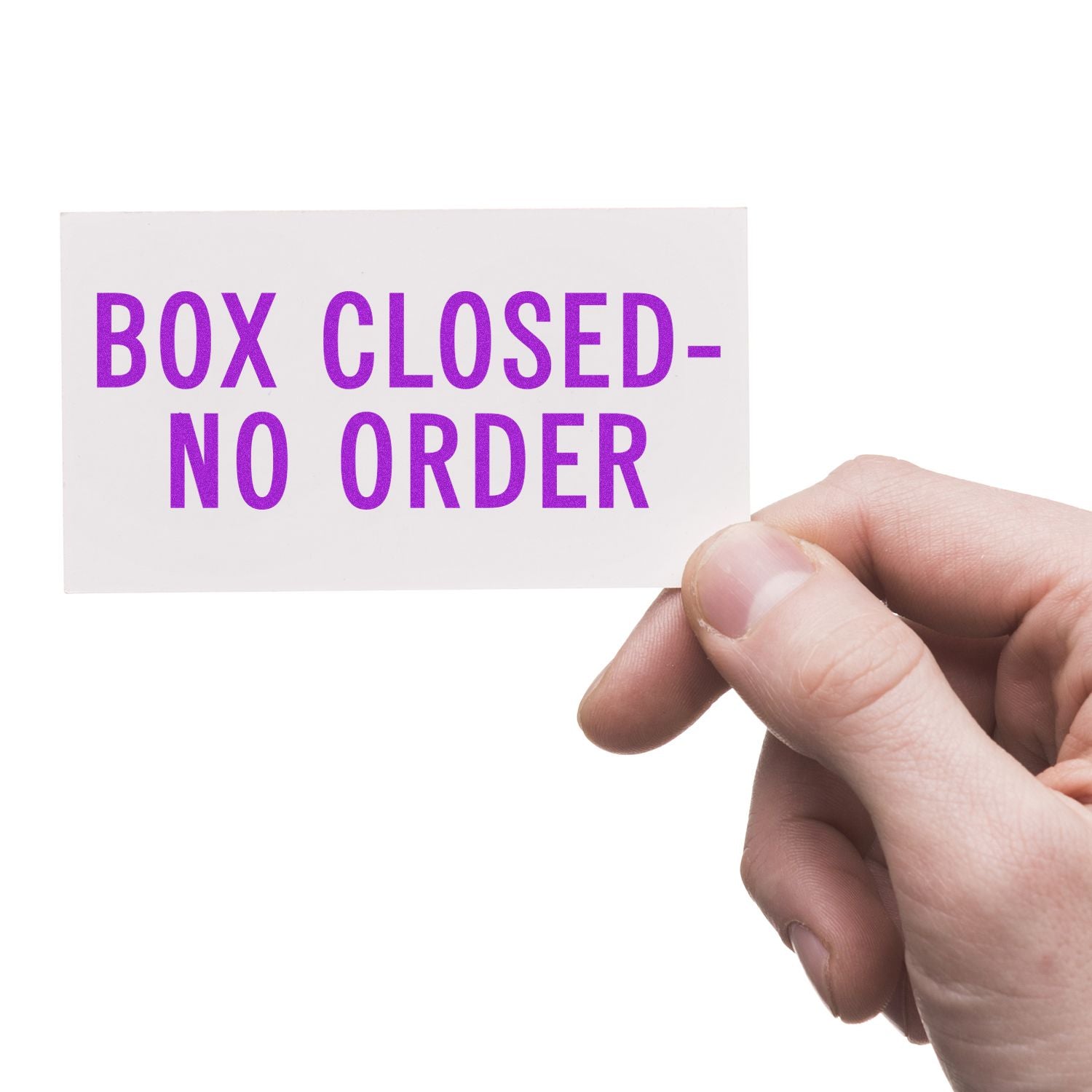 Hand holding a white card with a purple Box Closed No Order rubber stamp text against a white background.