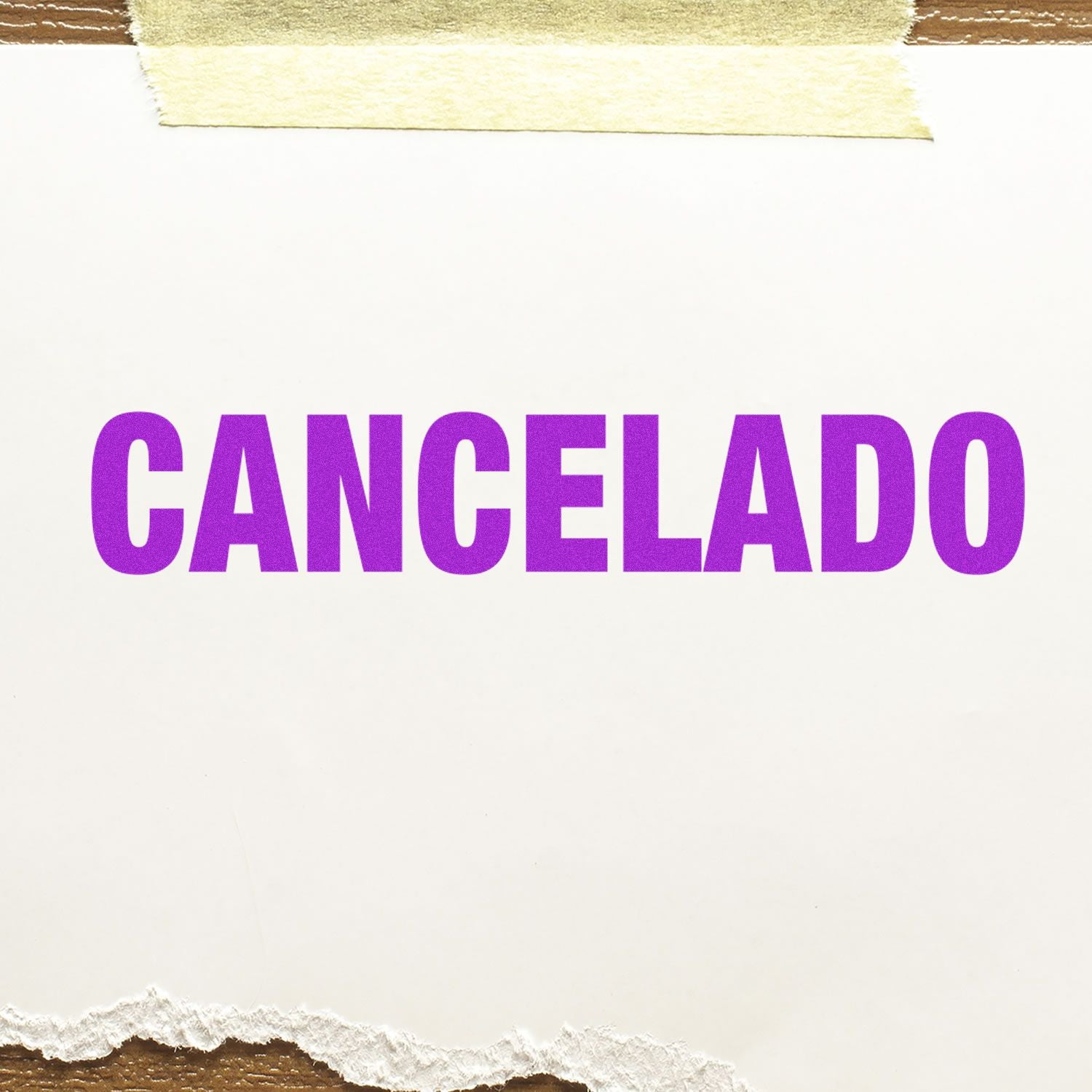 Self Inking Cancelado Stamp imprint in bold purple letters on white paper, with torn edges and a piece of tape at the top.