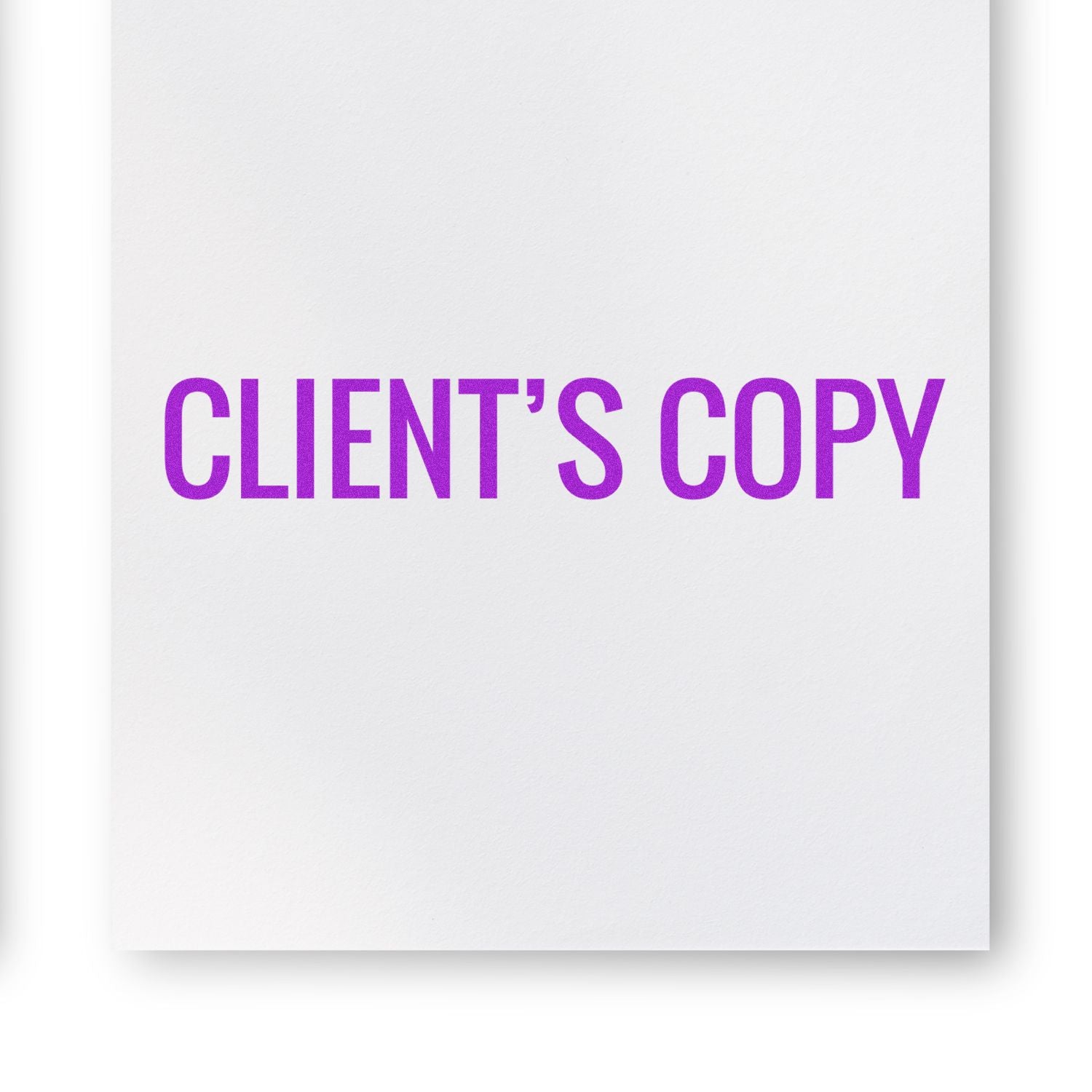 Large Pre-Inked Client's Copy Stamp in use, displaying the text CLIENT'S COPY in bold purple on a white sheet of paper.