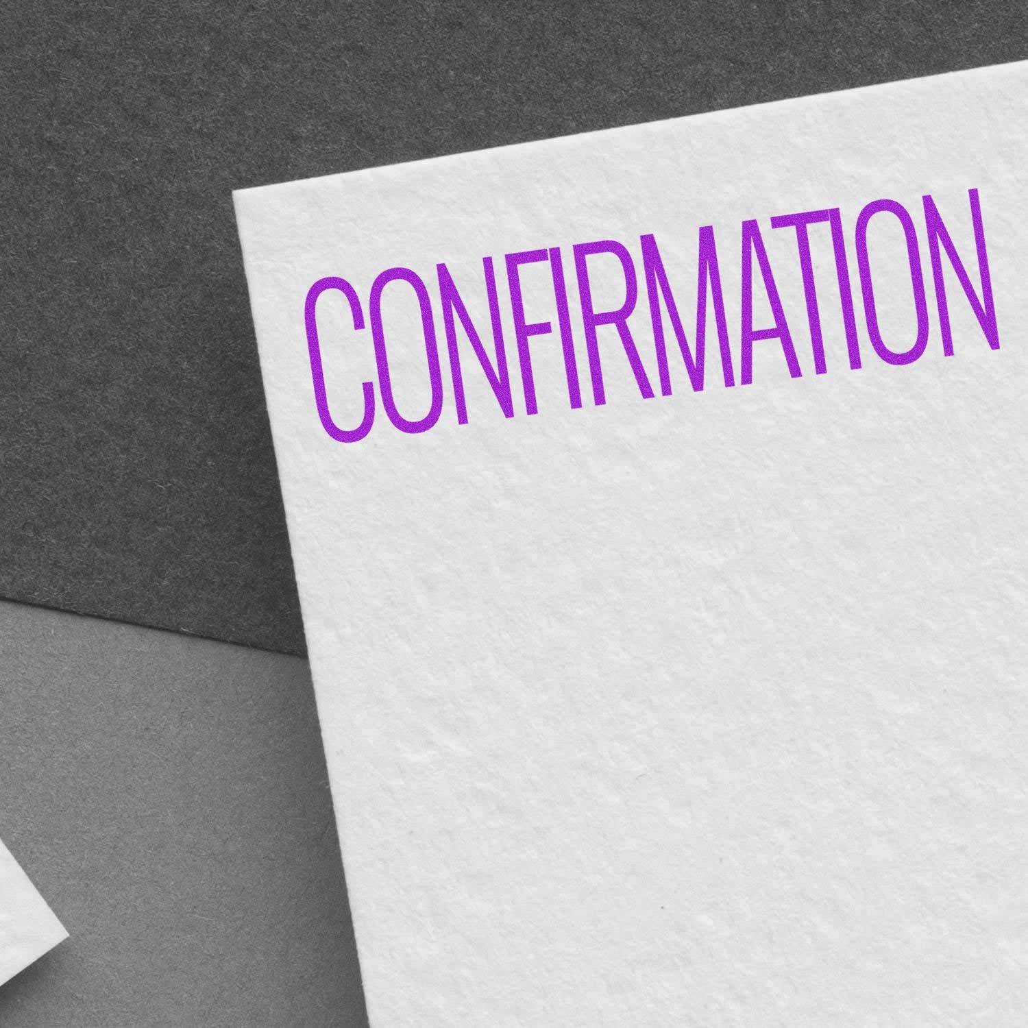 Document stamped with 'CONFIRMATION' in purple ink using the Self Inking Confirmation Stamp, placed on a textured white paper.