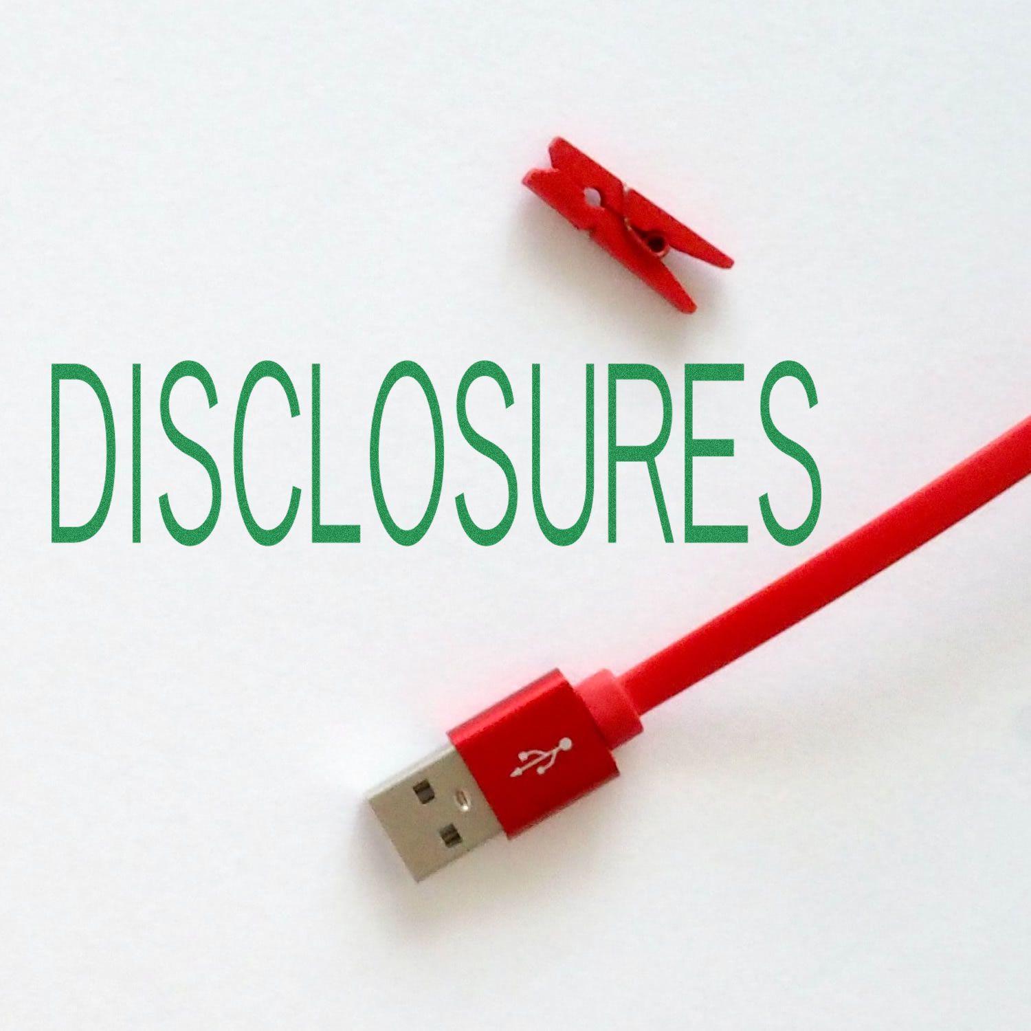 Red USB cable and clip next to green text DISCLOSURES stamped using the Disclosures Rubber Stamp on a white background.