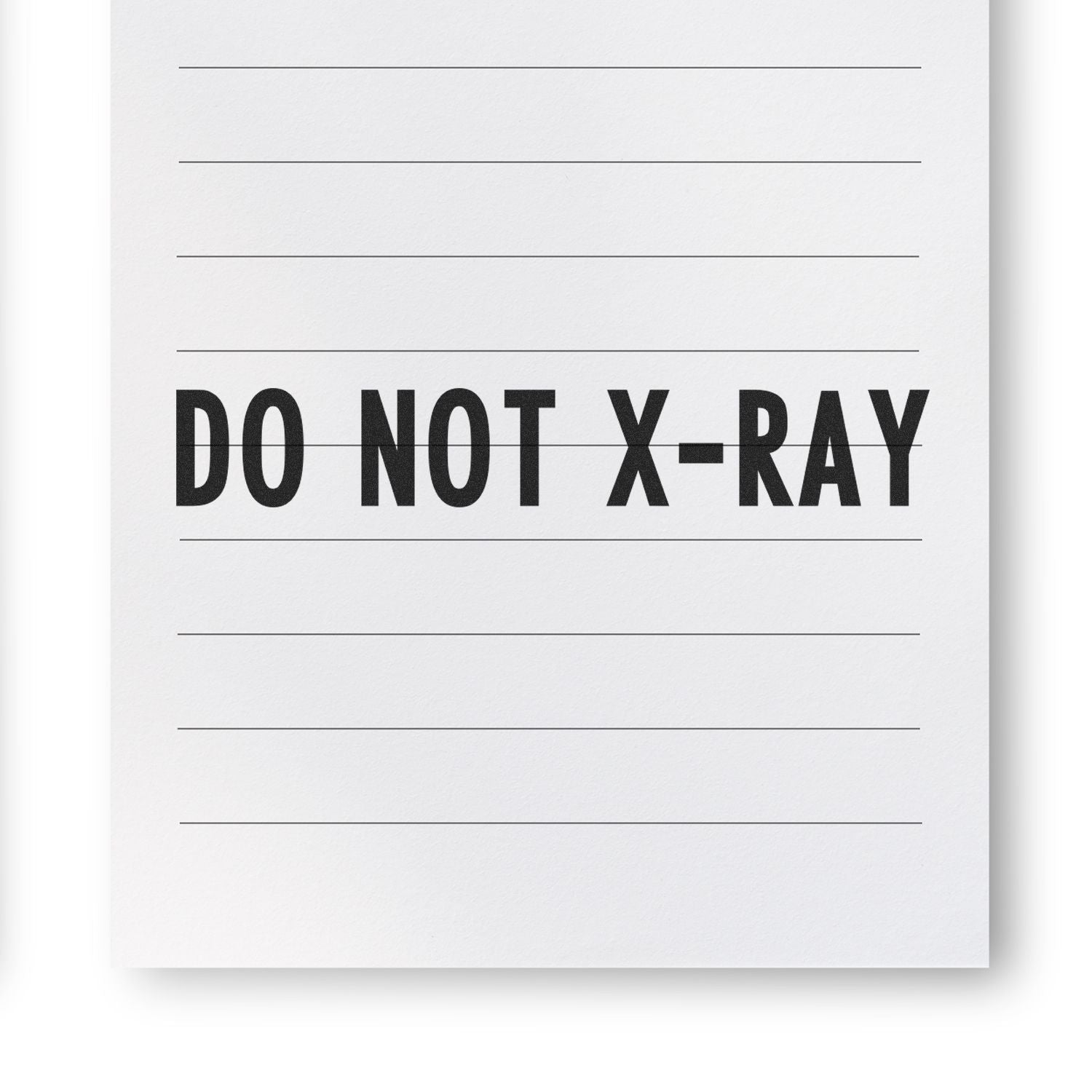 Large Pre-Inked Do Not X-Ray Stamp imprint on a lined white paper, showing clear and bold black text.