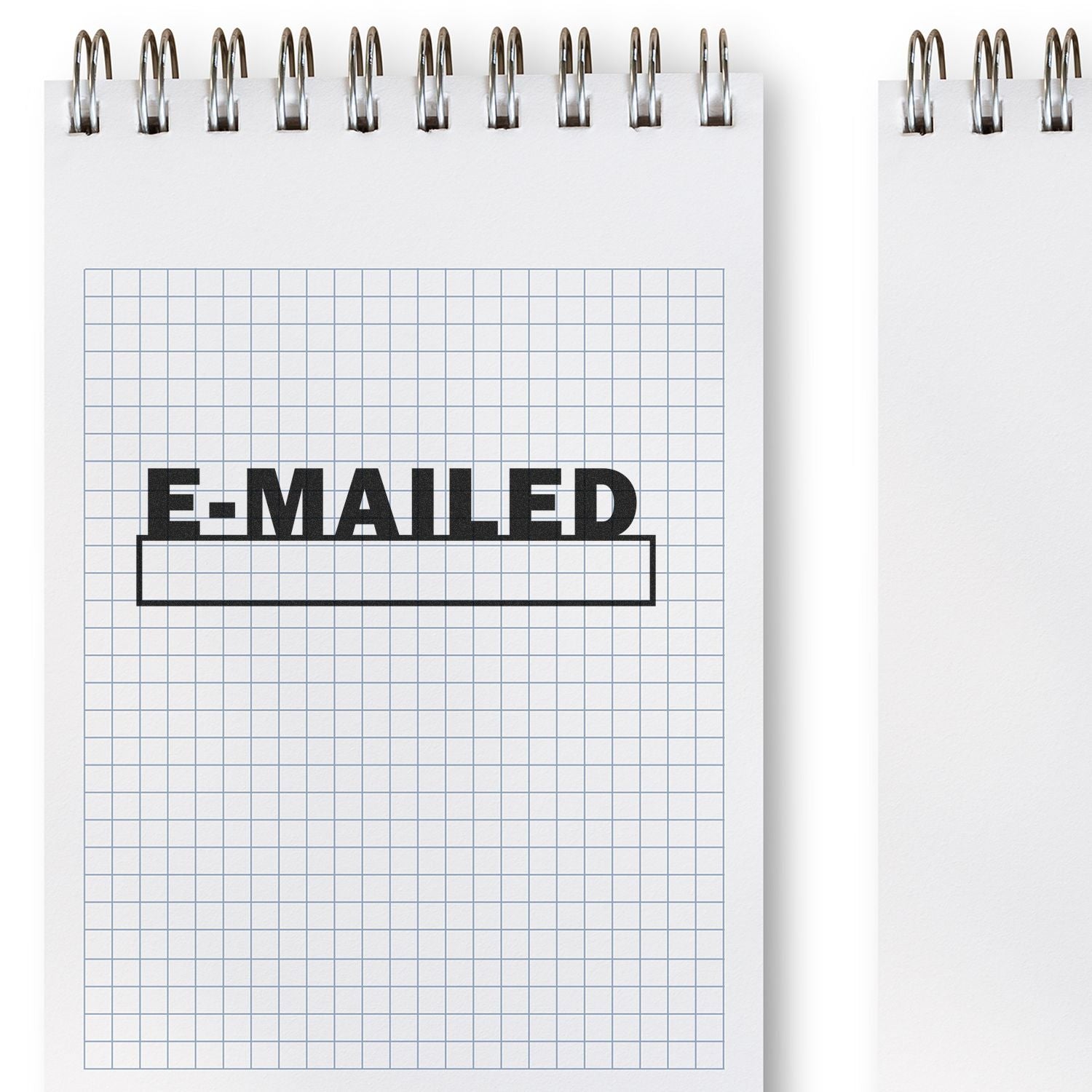 Self Inking E-mailed with Date Box Stamp used on a grid notebook, showing the E-MAILED text and a blank date box below it.