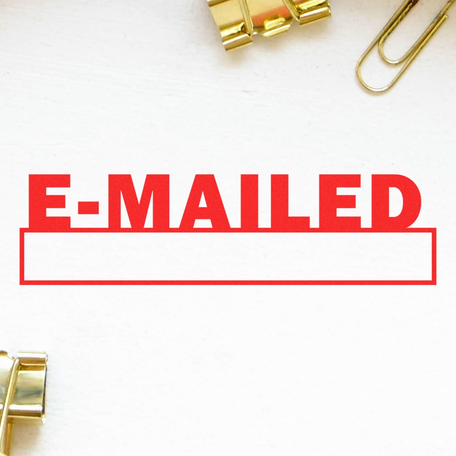 Large Self Inking E-mailed with Date Box Stamp in red ink on white paper, surrounded by gold binder clips and paperclips.