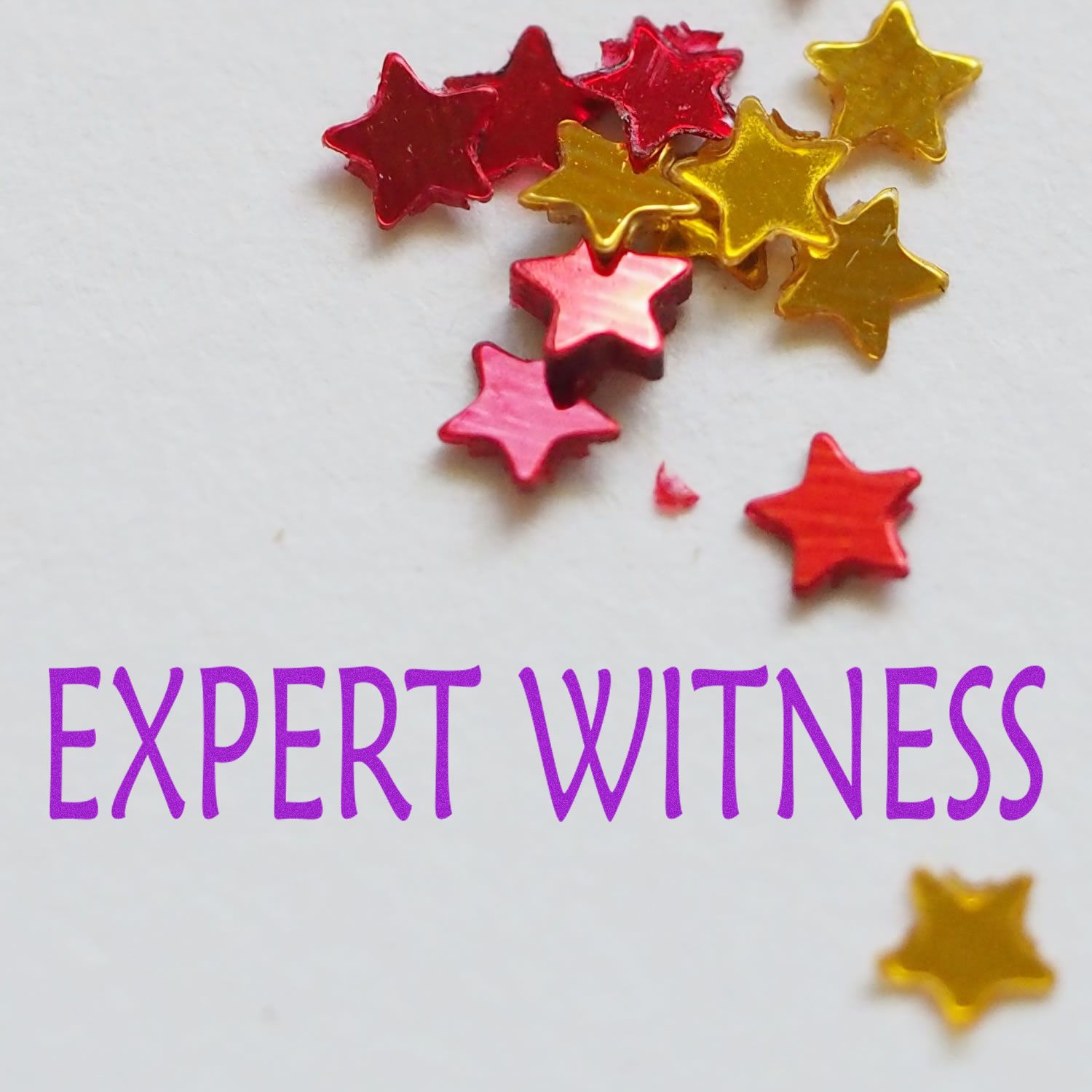 Expert Witness Rubber Stamp impression on white paper with red and gold star-shaped confetti scattered around.