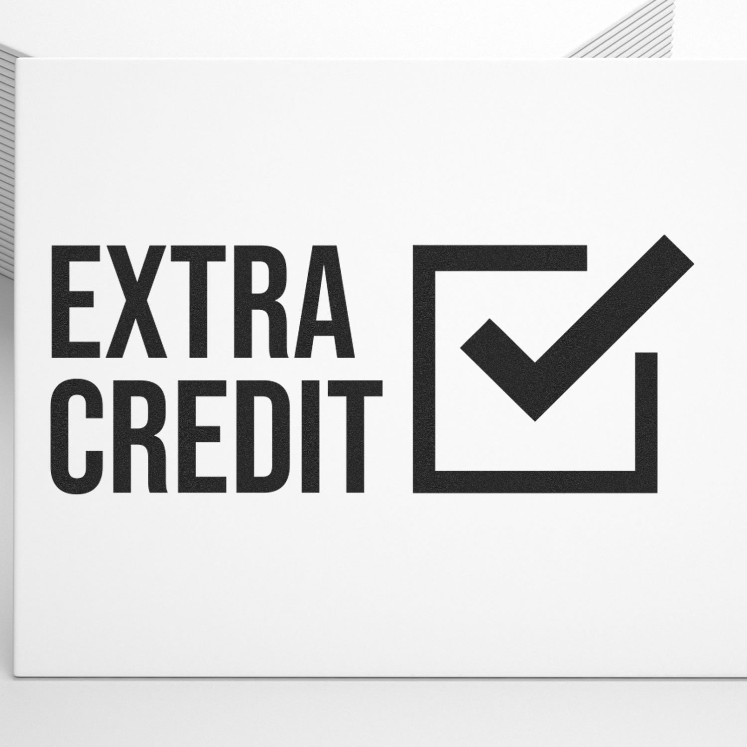 Large Self Inking Extra Credit Stamp in use, showing a bold EXTRA CREDIT text with a checkmark inside a square on a white background.