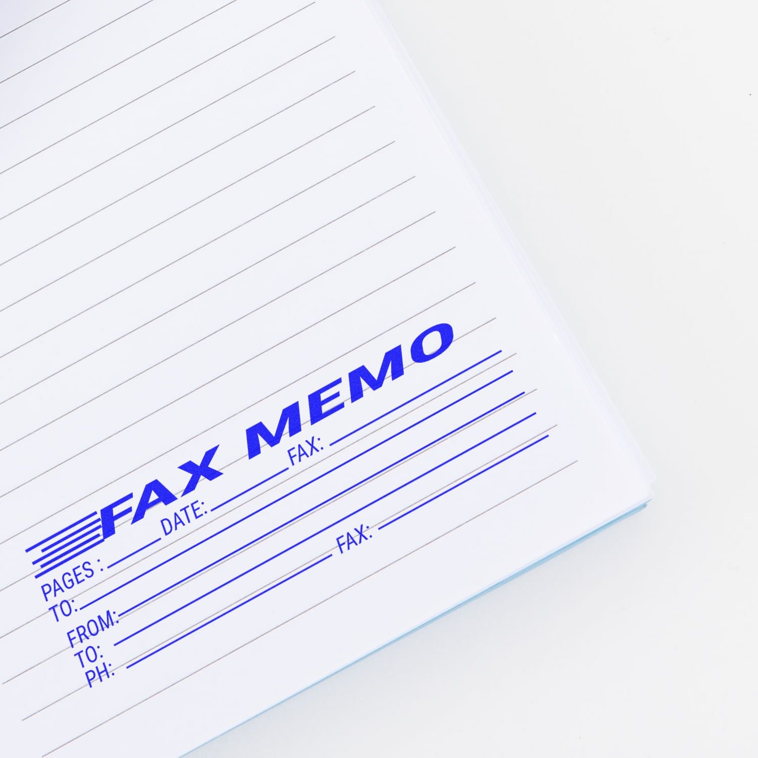 Close-up of a document stamped with the Large Self Inking Fax Memo Stamp, showing fields for pages, date, from, to, fax, and phone.