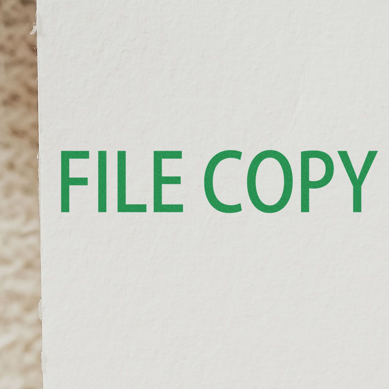 Close-up of a green FILE COPY imprint on white paper using the File Copy Rubber Stamp.