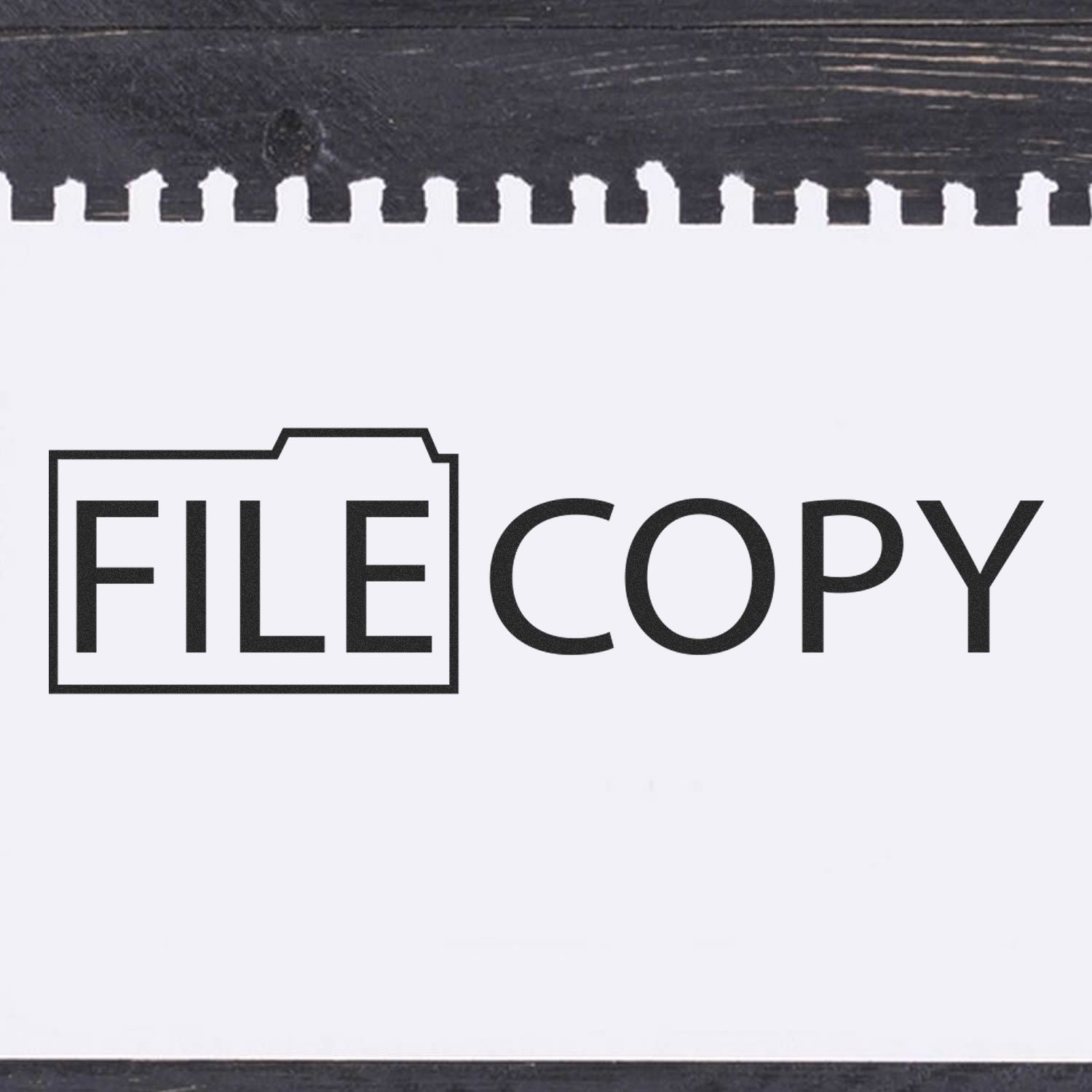 File Copy with Folder Rubber Stamp imprint on white paper, showing the text FILE COPY with a folder icon around the word FILE.