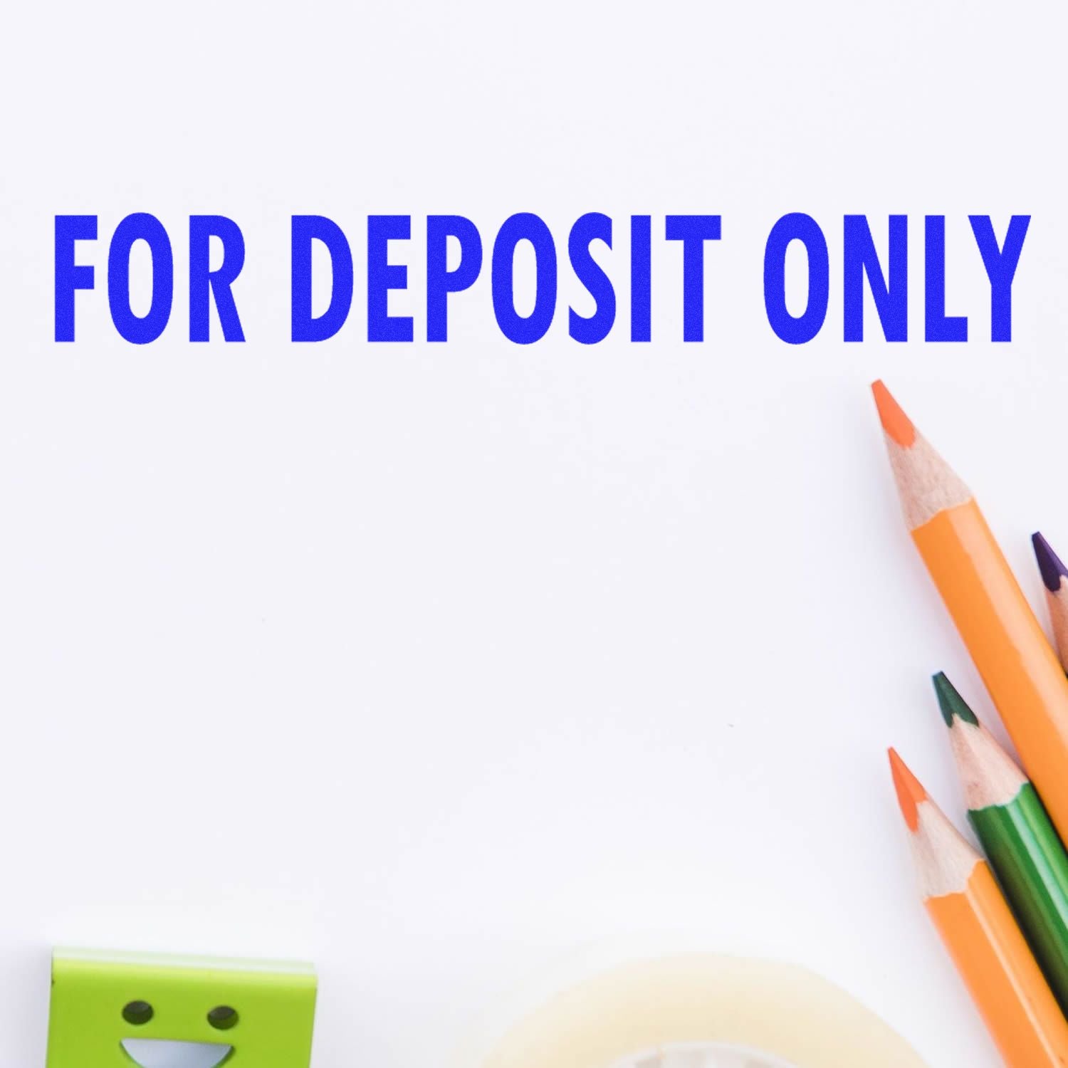 Large For Deposit Only Rubber Stamp in blue ink on white paper, with colorful pencils and a green eraser nearby.