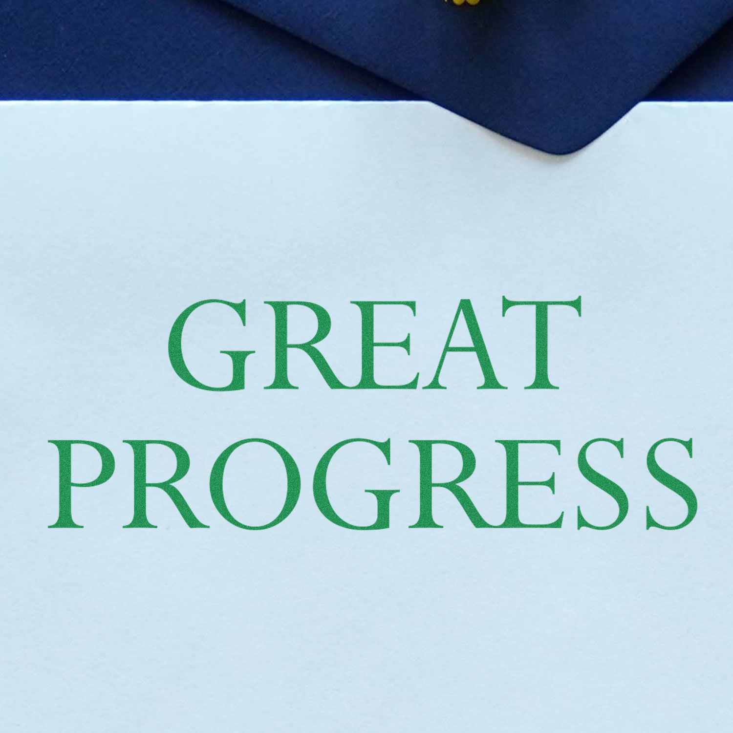 Great Progress Rubber Stamp impression in green ink on white paper, partially covered by a dark blue envelope.