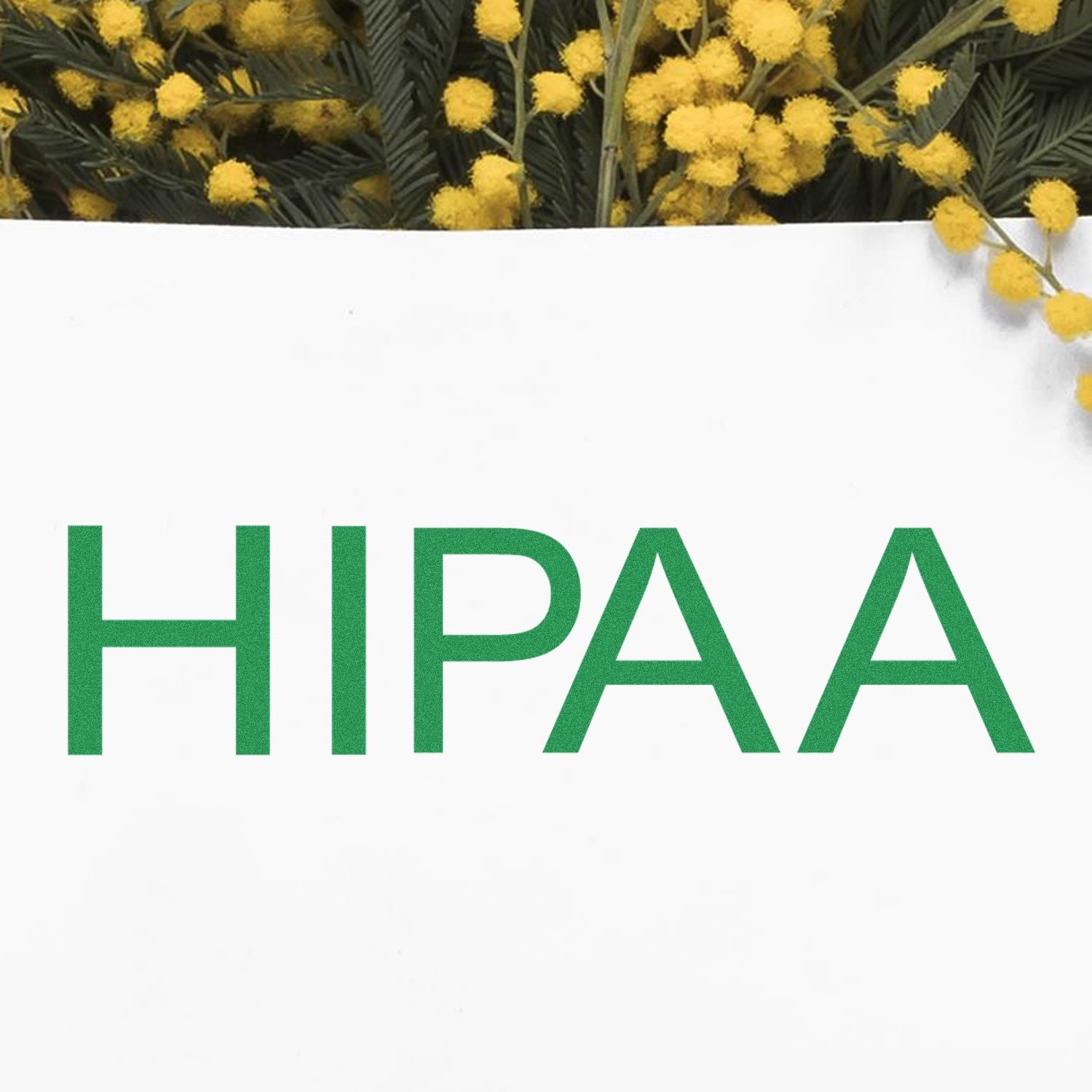 Slim Pre-Inked HIPAA Stamp in green ink on white paper, with yellow flowers in the background.