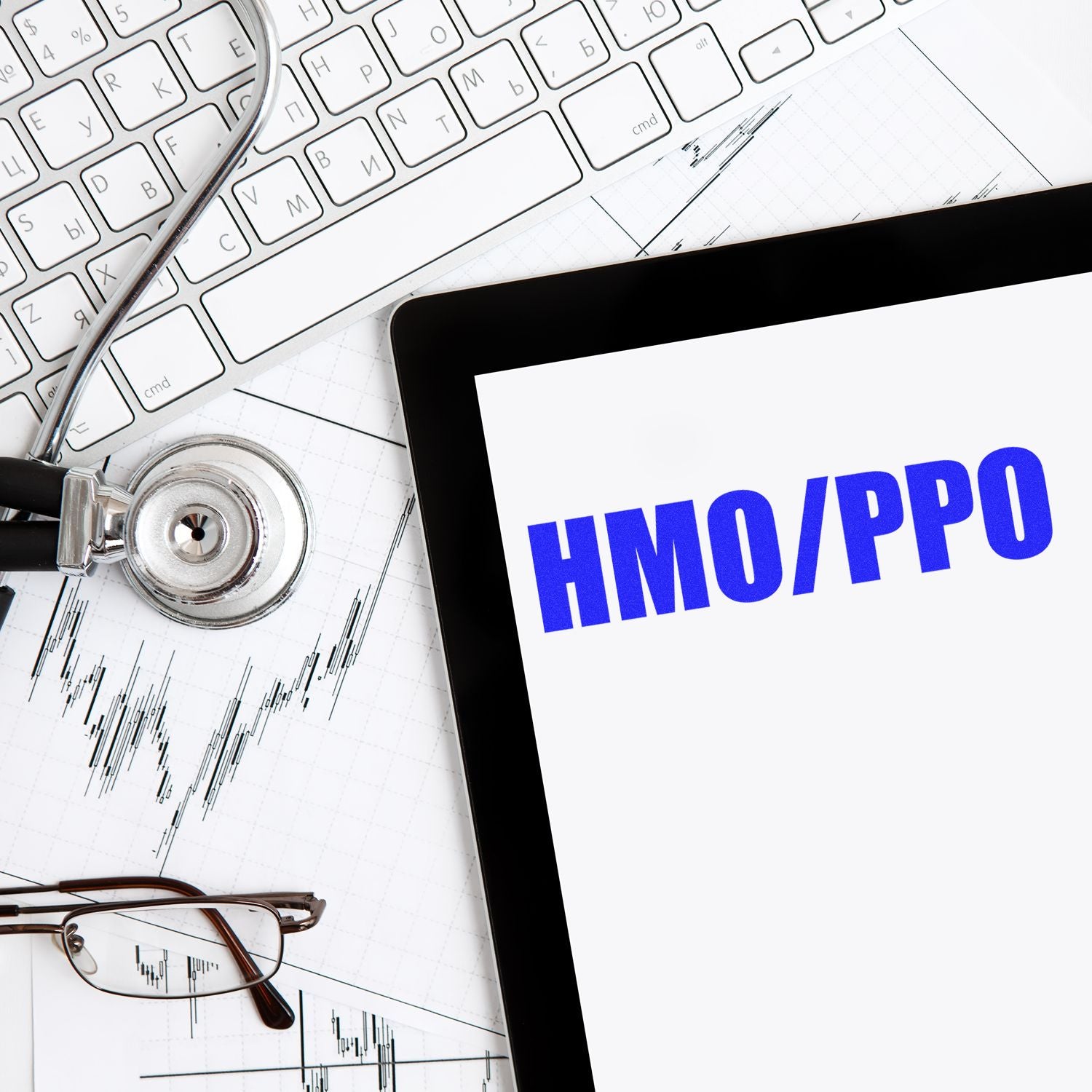 Large Pre-Inked HMO/PPO Stamp in use on a document, with a stethoscope, keyboard, and glasses in the background.