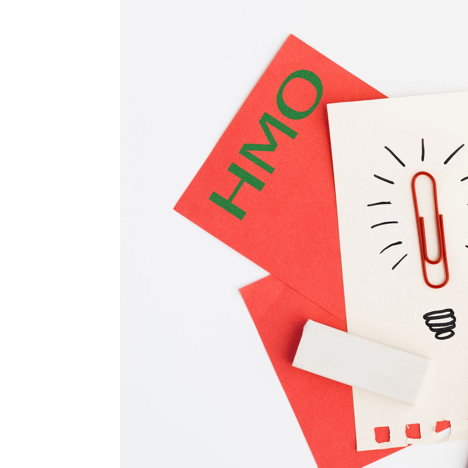 Large Self Inking HMO Stamp in use on red and white paper, featuring a lightbulb and paperclip design.