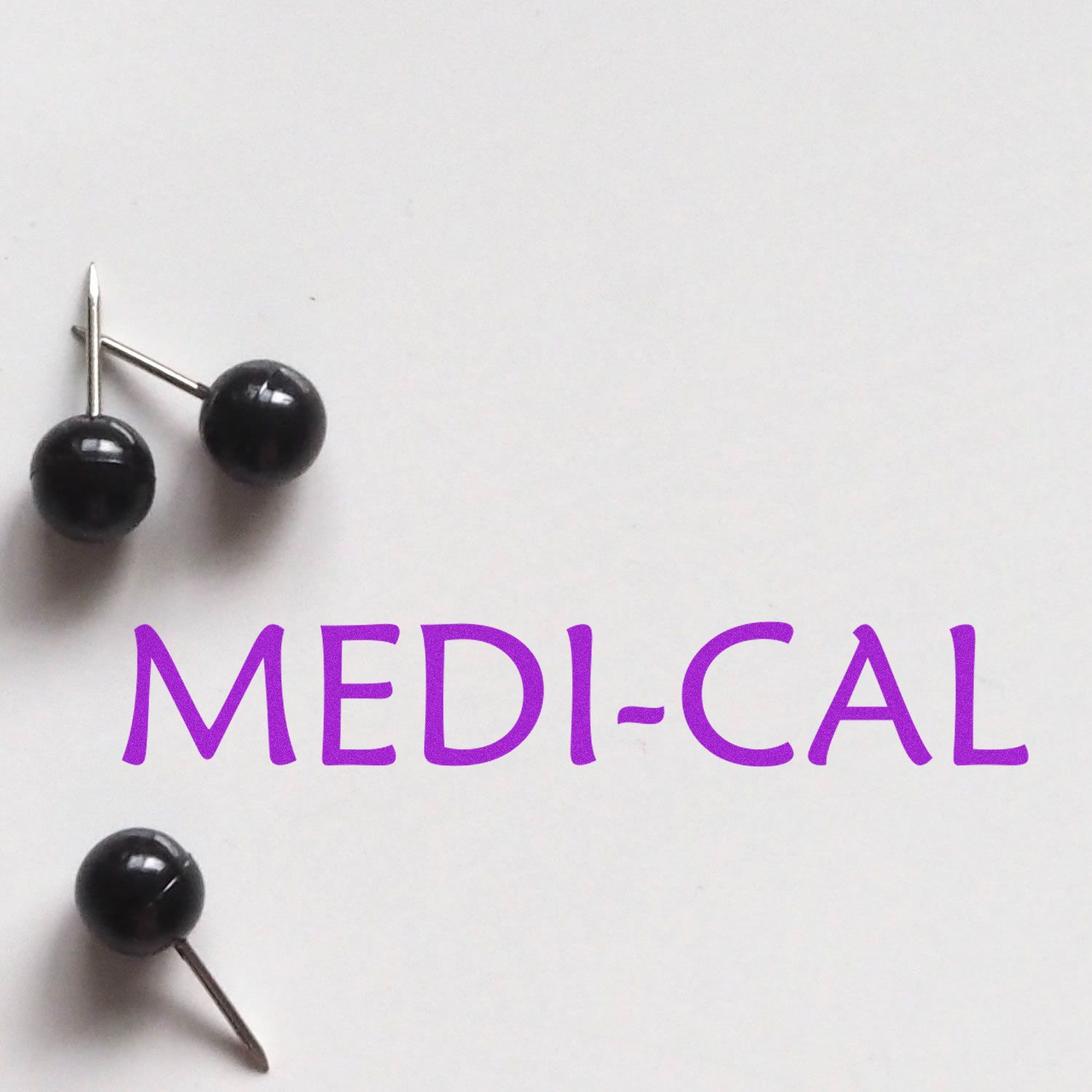 Large Medi Cal Rubber Stamp in use, displaying the text MEDI-CAL in purple ink on white paper with black push pins nearby.