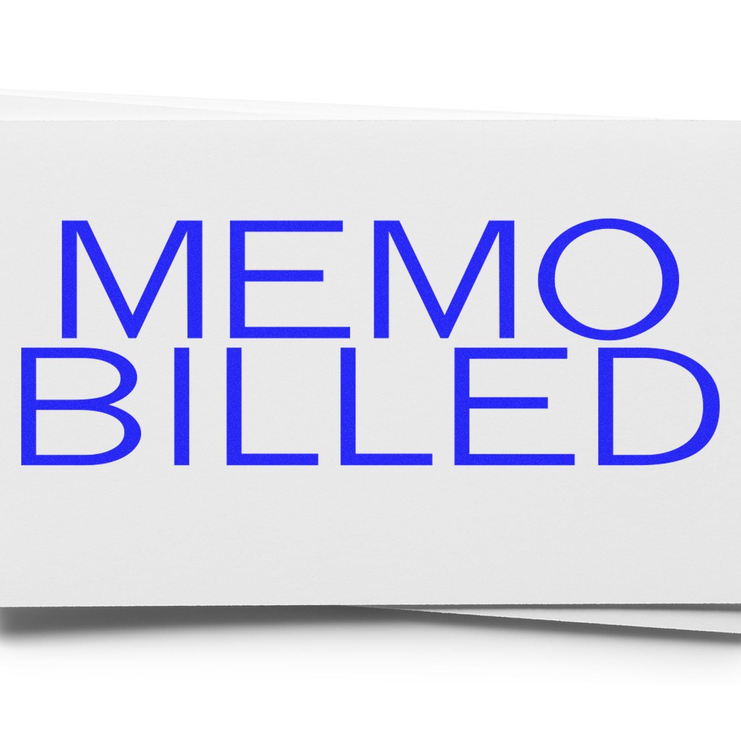 Large Memo Billed Rubber Stamp in use, displaying the text MEMO BILLED in bold blue letters on a white background.