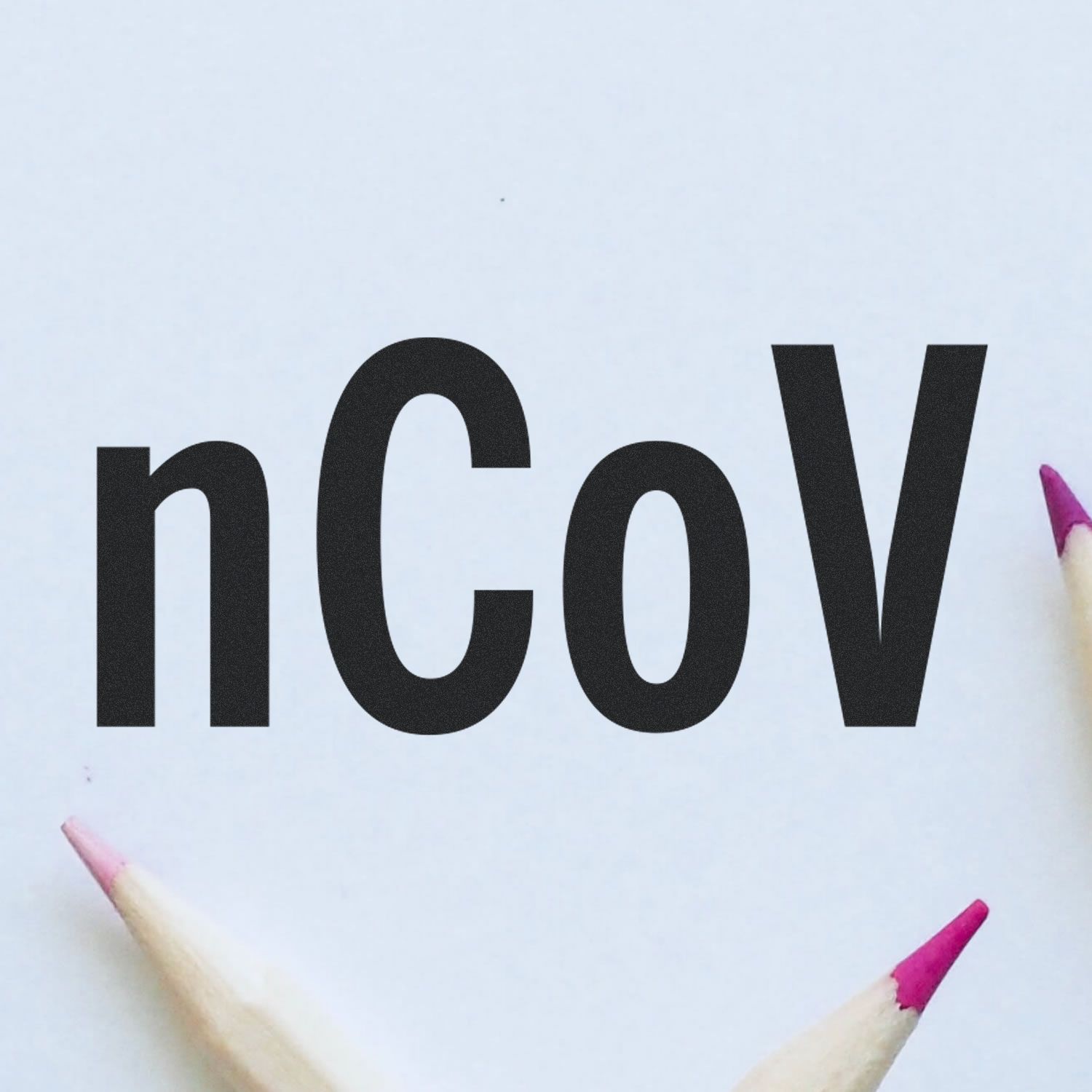 Large Pre-Inked nCov Stamp imprint on white paper, surrounded by three pencils with pink tips.