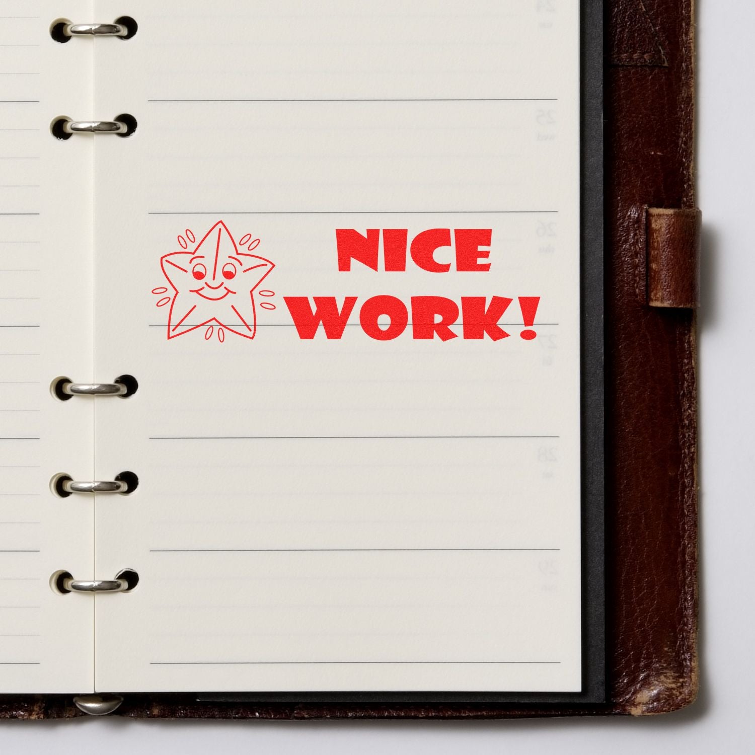 Large Self Inking Nice Work Stamp in red ink on a lined notebook page, featuring a smiling star and the text NICE WORK!