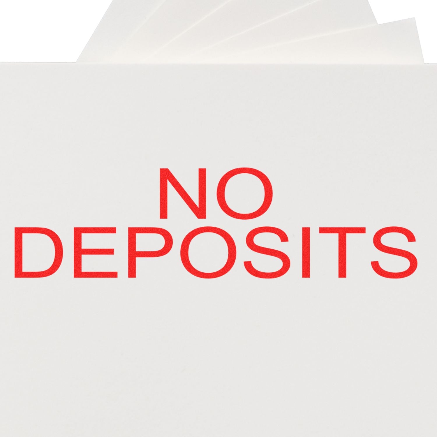 No Deposits rubber stamp in red ink on white paper, emphasizing a clear message of no deposits required.