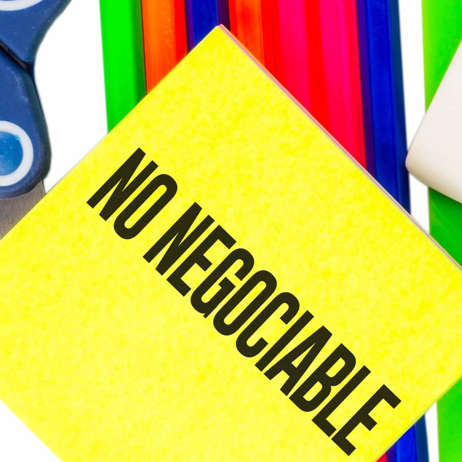 Large Self Inking No Negociable Stamp in use on a bright yellow paper, surrounded by colorful office supplies.